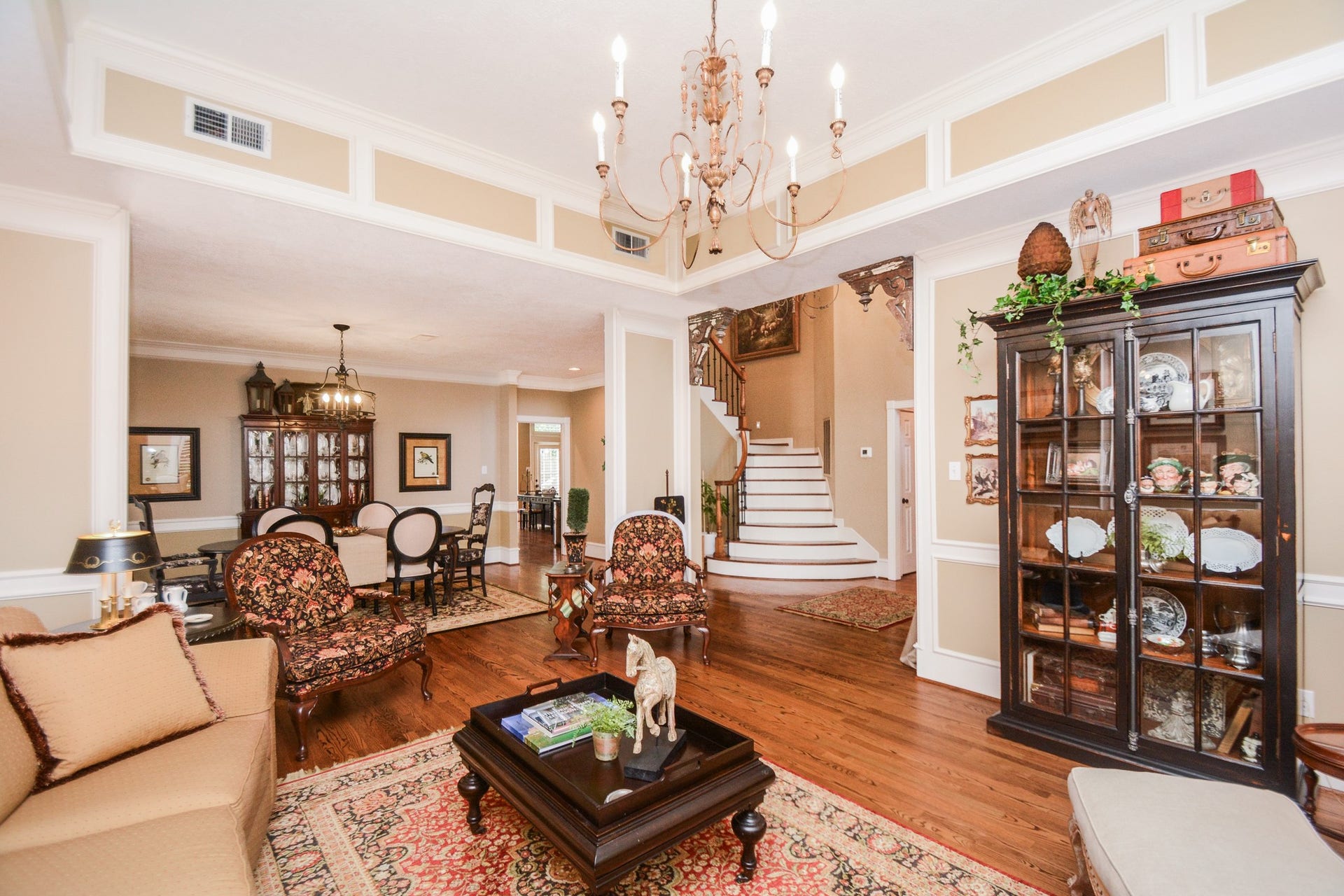 Beautiful hardwood flooring connects the living and dining areas, creating a welcoming setting for entertaining.
