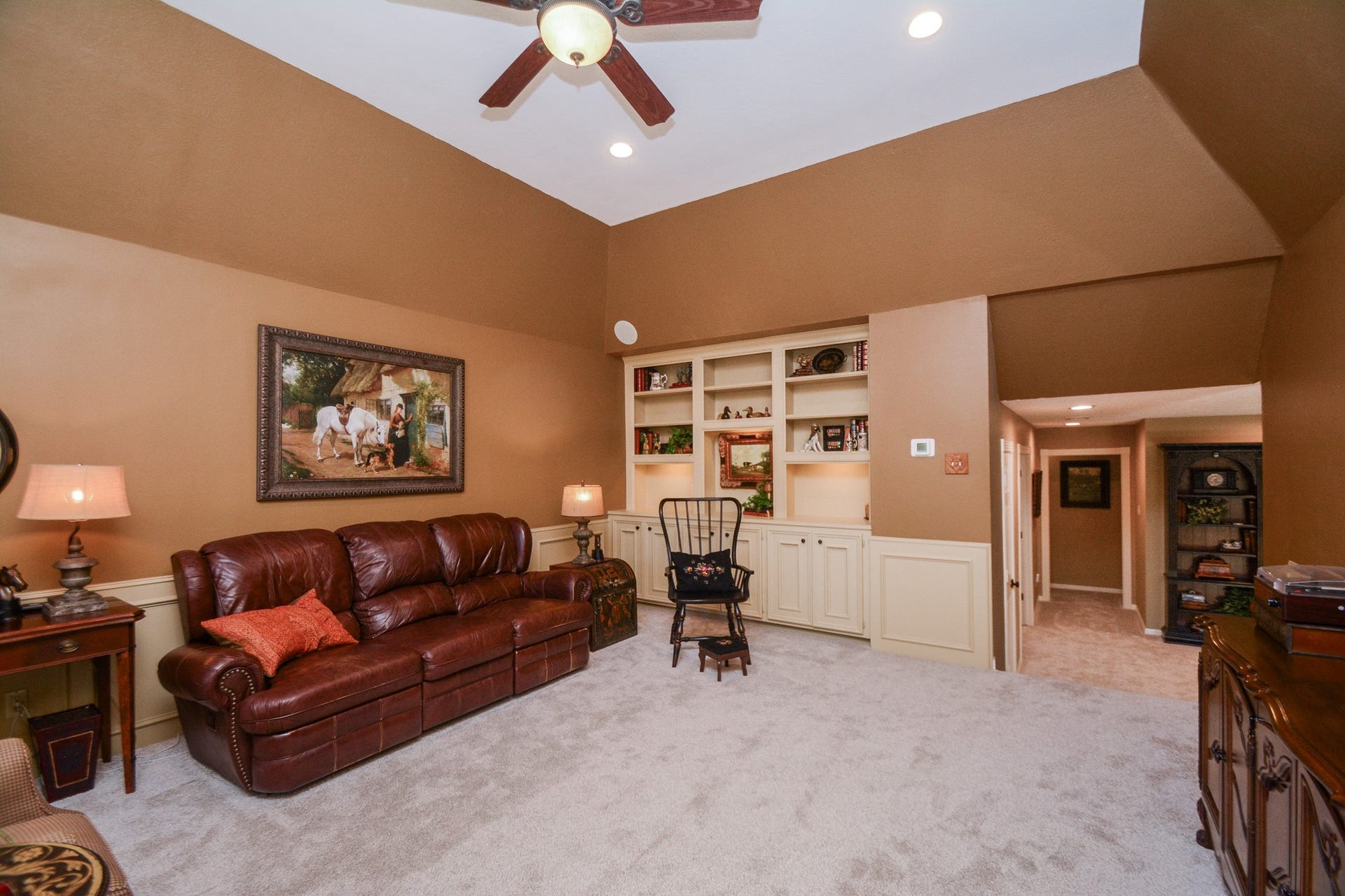 The spacious game room, shown as an upstairs living area, offers plenty of flexibility for recreation, hobbies, or relaxing, with carpeting replaced in October 2026.