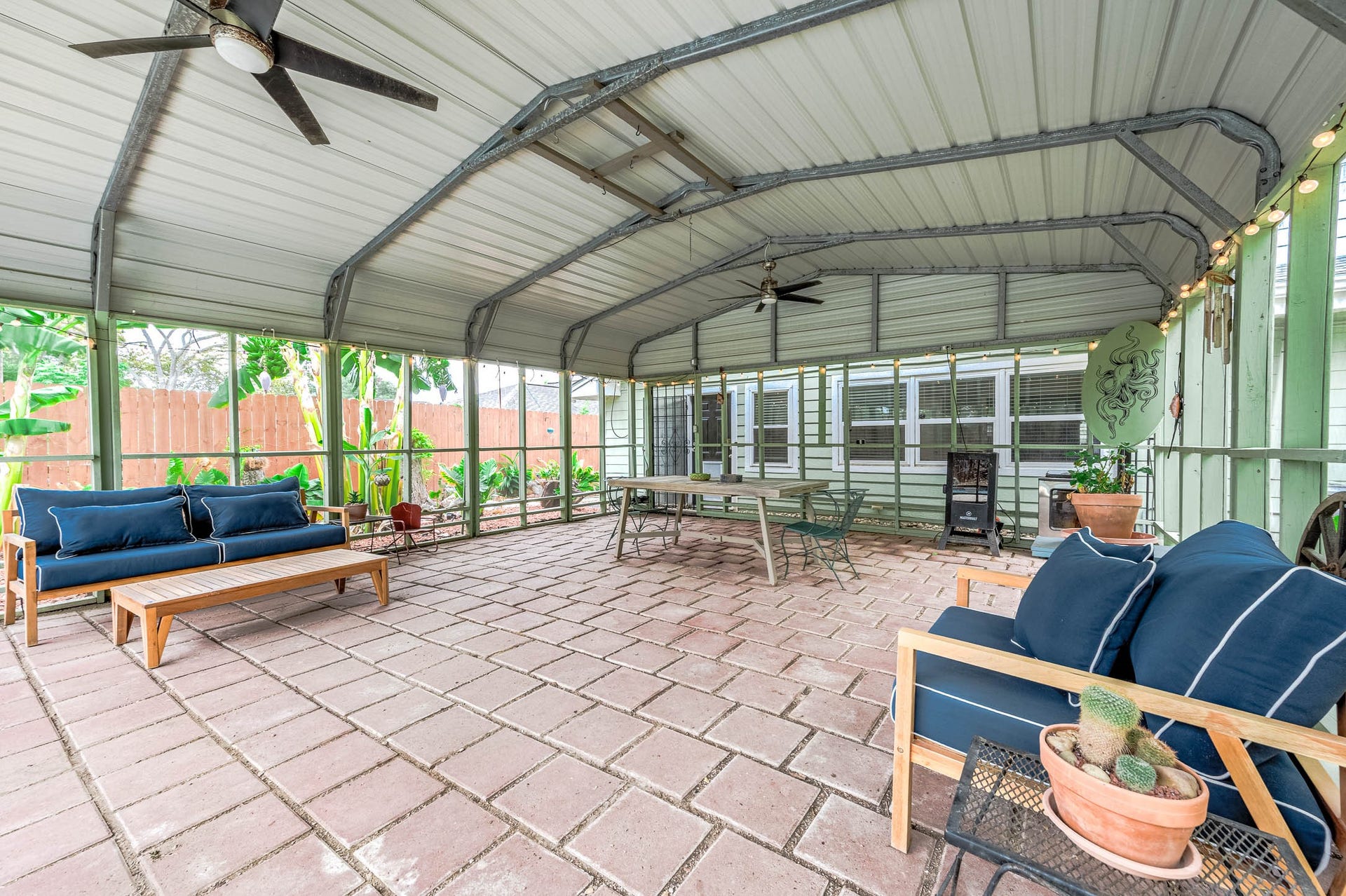 115 S Yaupon Street, Lake Jackson, TX 77566 Paver-floored screened porch steps out to the pool.