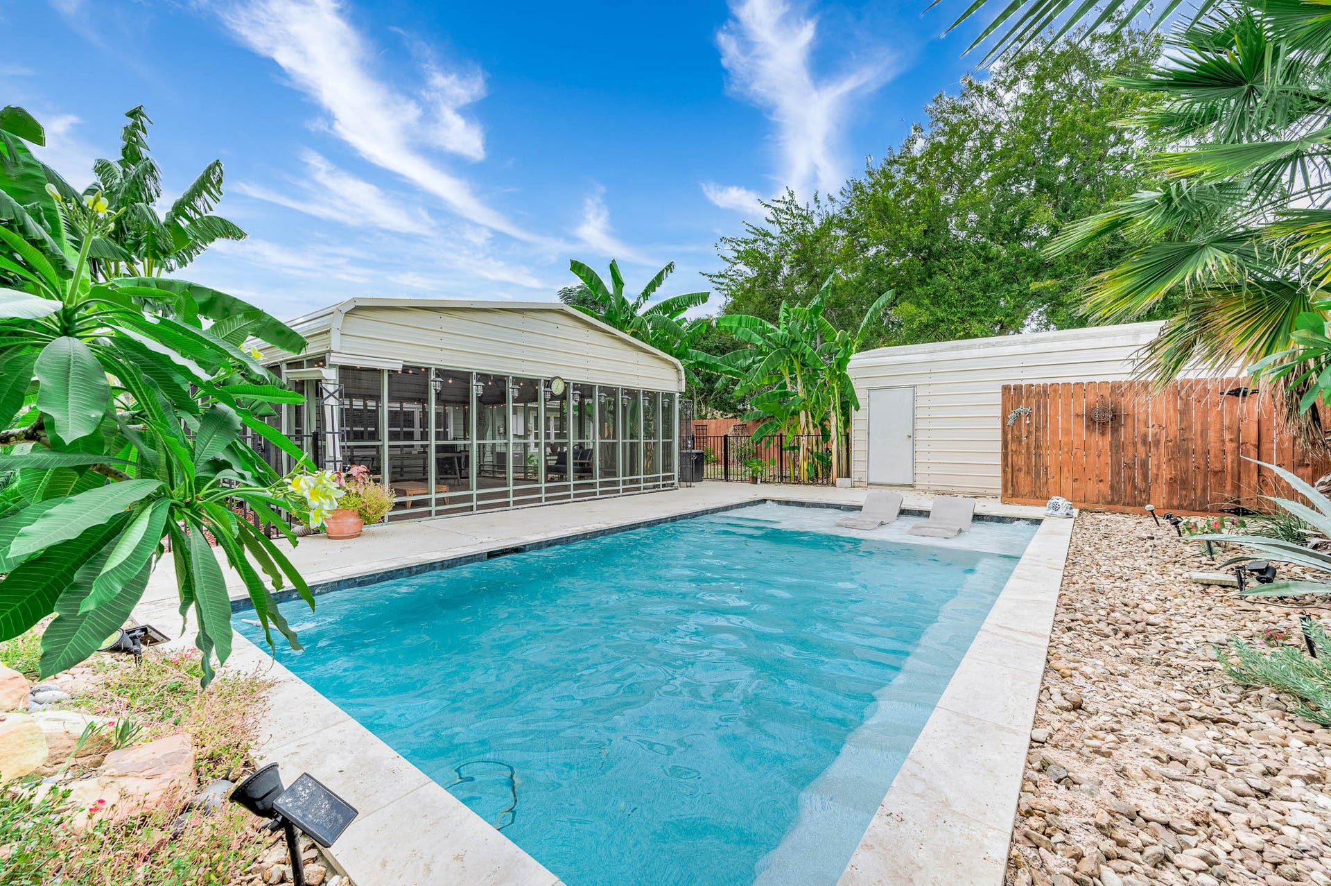 115 S Yaupon Street, Lake Jackson, TX 77566 Pool and metal storage shed in the fenced backyard.