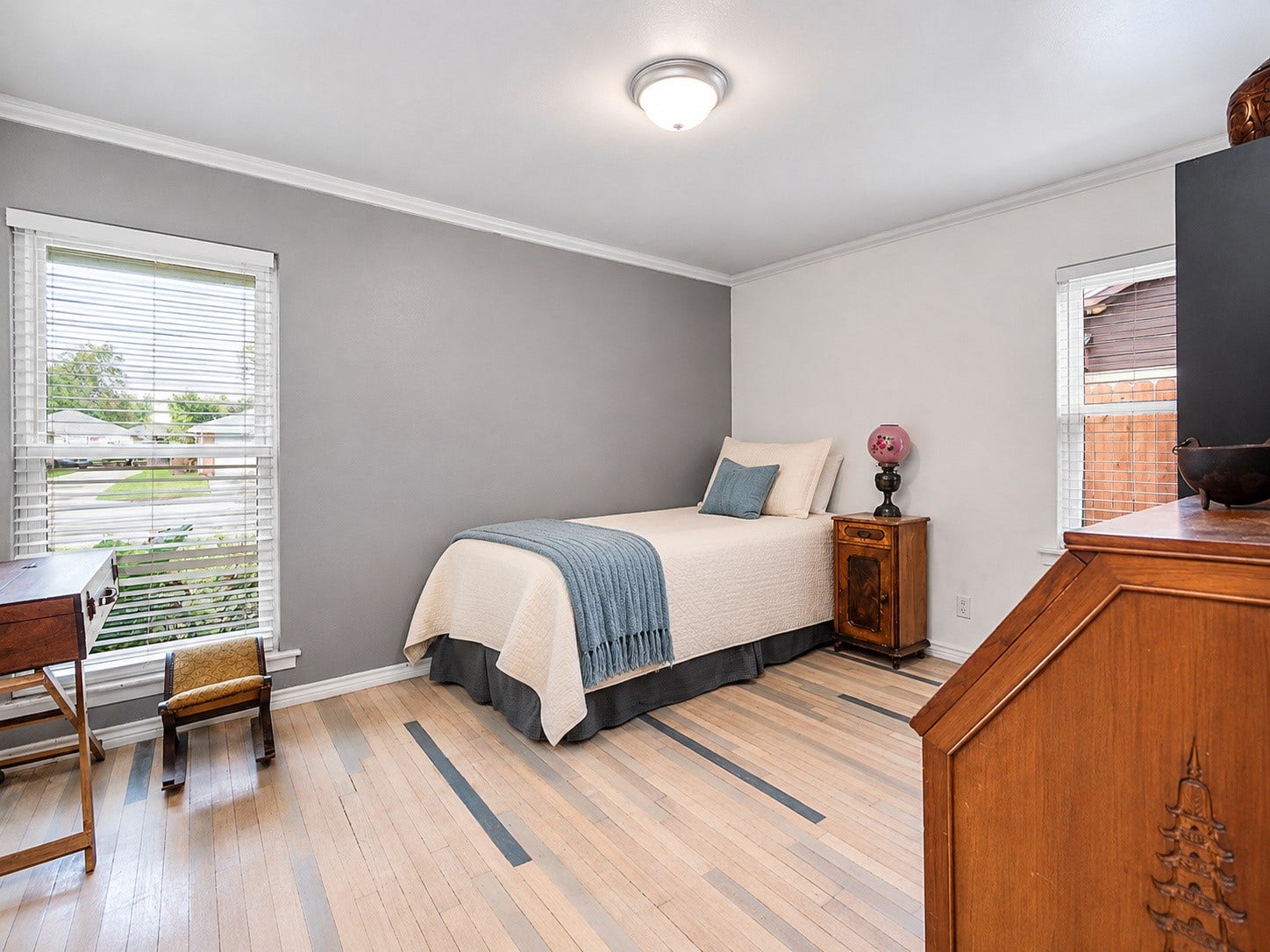 115 S Yaupon Street, Lake Jackson, TX 77566 Secondary bedroom with crown molding and natural light.