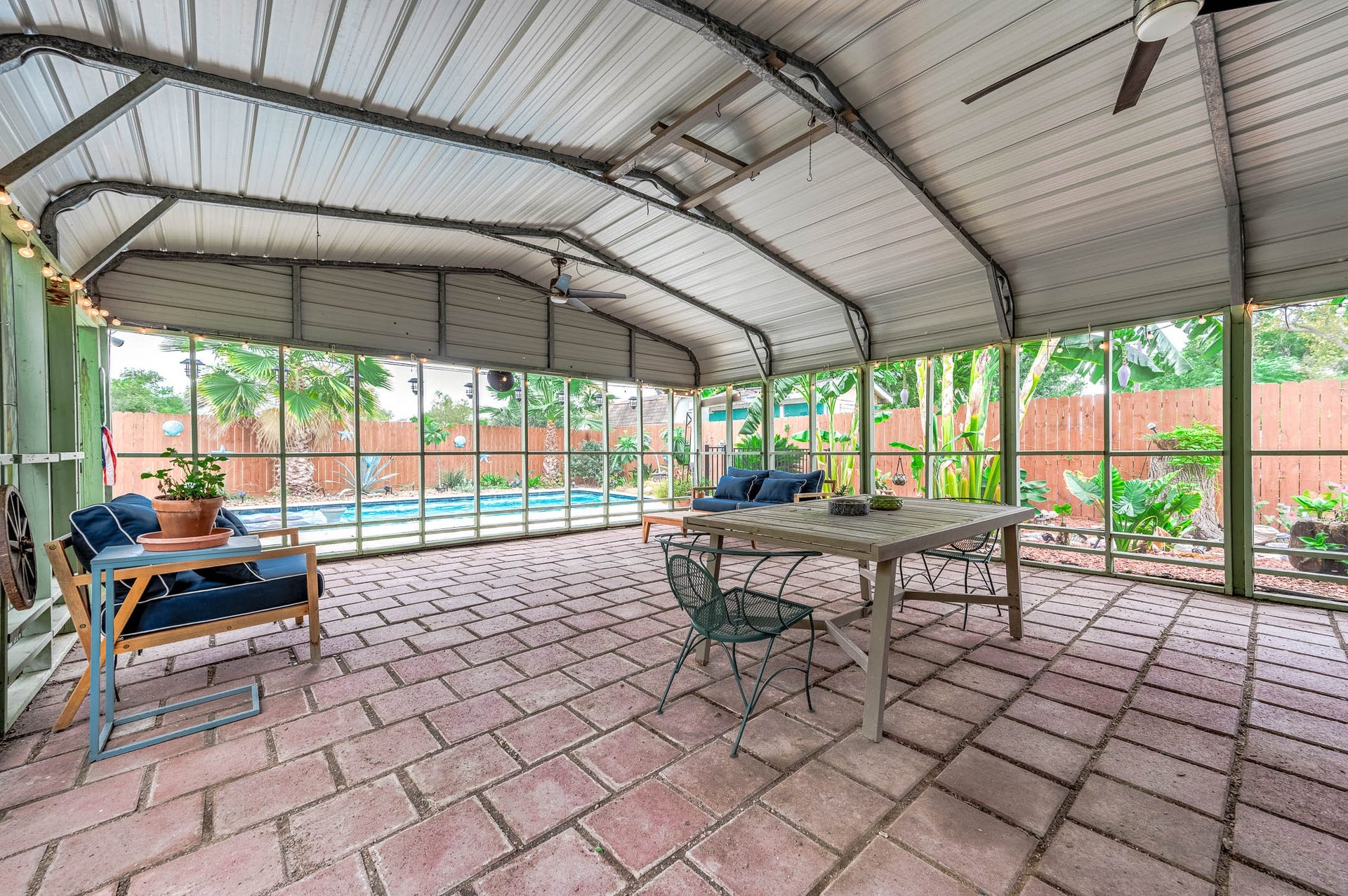 115 S Yaupon Street, Lake Jackson, TX 77566 Screened back porch overlooking the pool - perfect for year-round outdoor living.