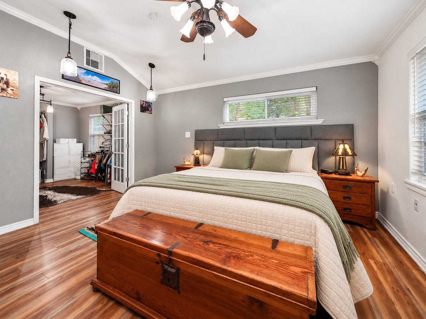 115 S Yaupon Street, Lake Jackson, TX 77566 Primary bedroom with French doors leading to the large walk-in closet.