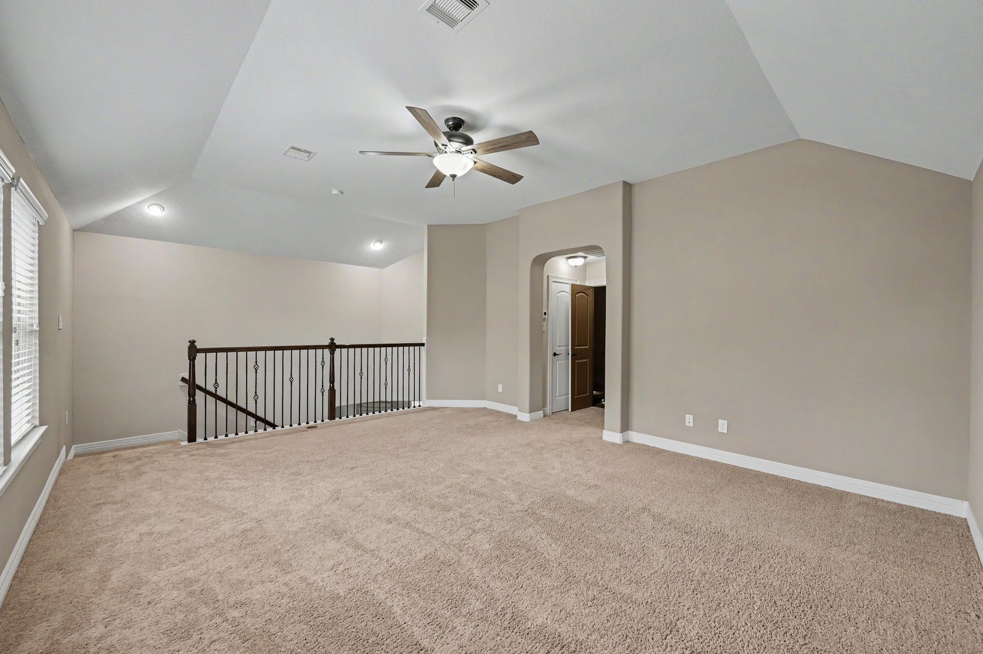 Another view of the spacious game room, offering plenty of potential to create a second living area for relaxing or entertaining.