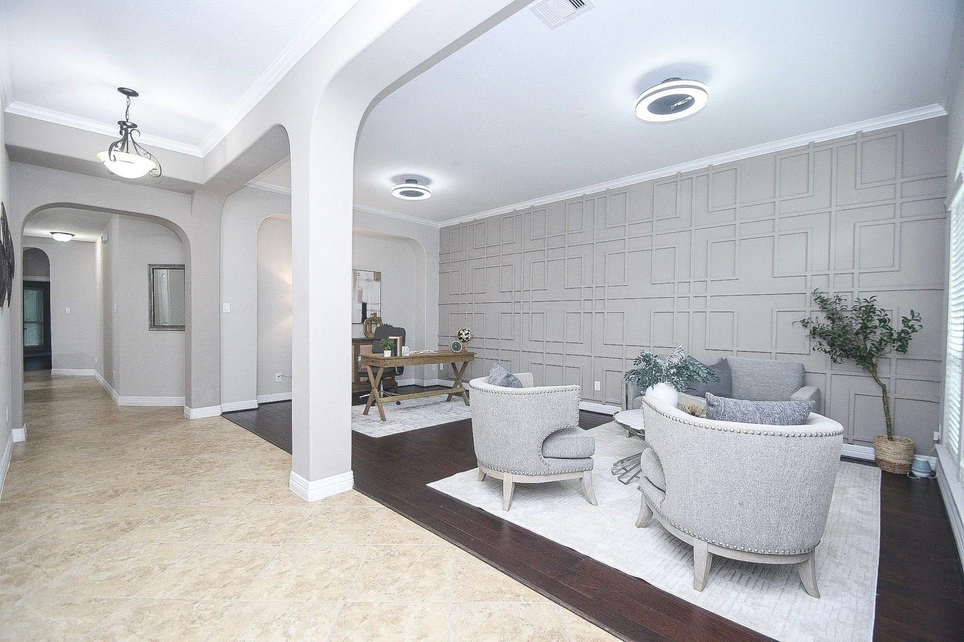 Versatile office or flex space with elegant arched openings and a spacious layout.