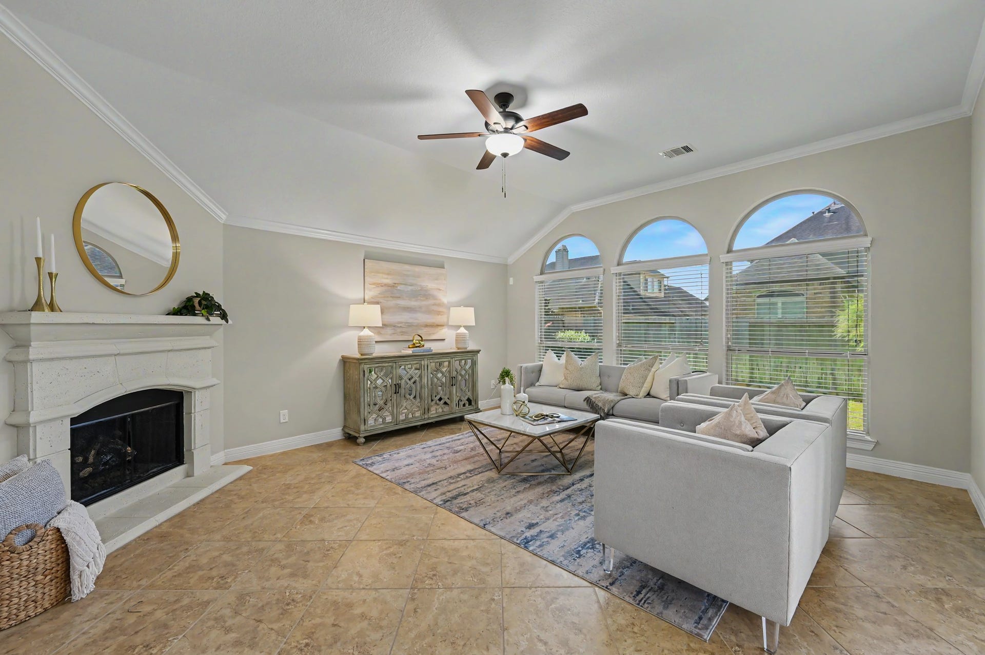Spacious family room, the true heart of a home. Enjoy tall ceilings, arched windows, gaslog fireplace, and room for the whole family