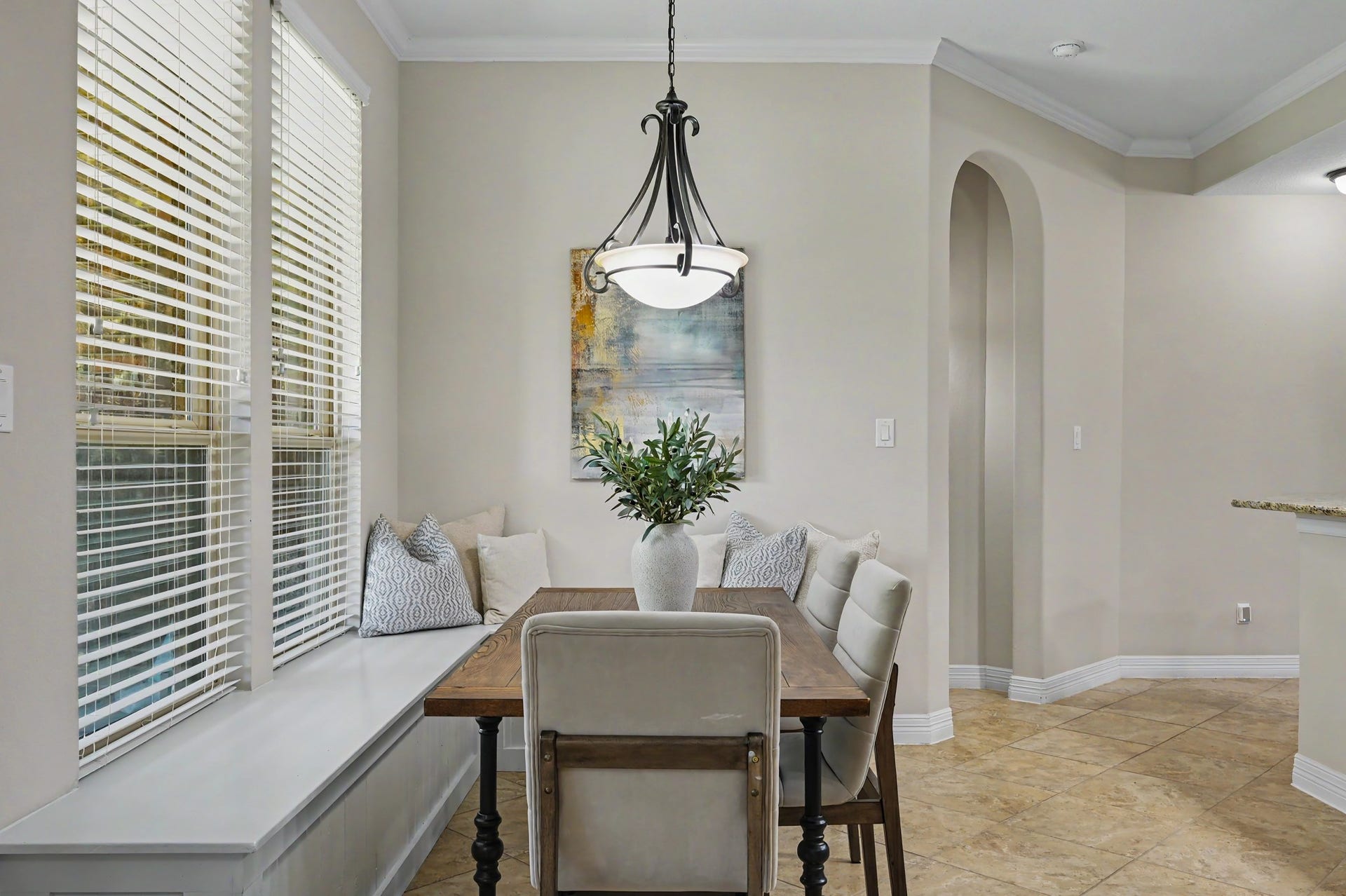 Custom built-in bench seating in breakfast nook, a charming addition not in the original floor plan