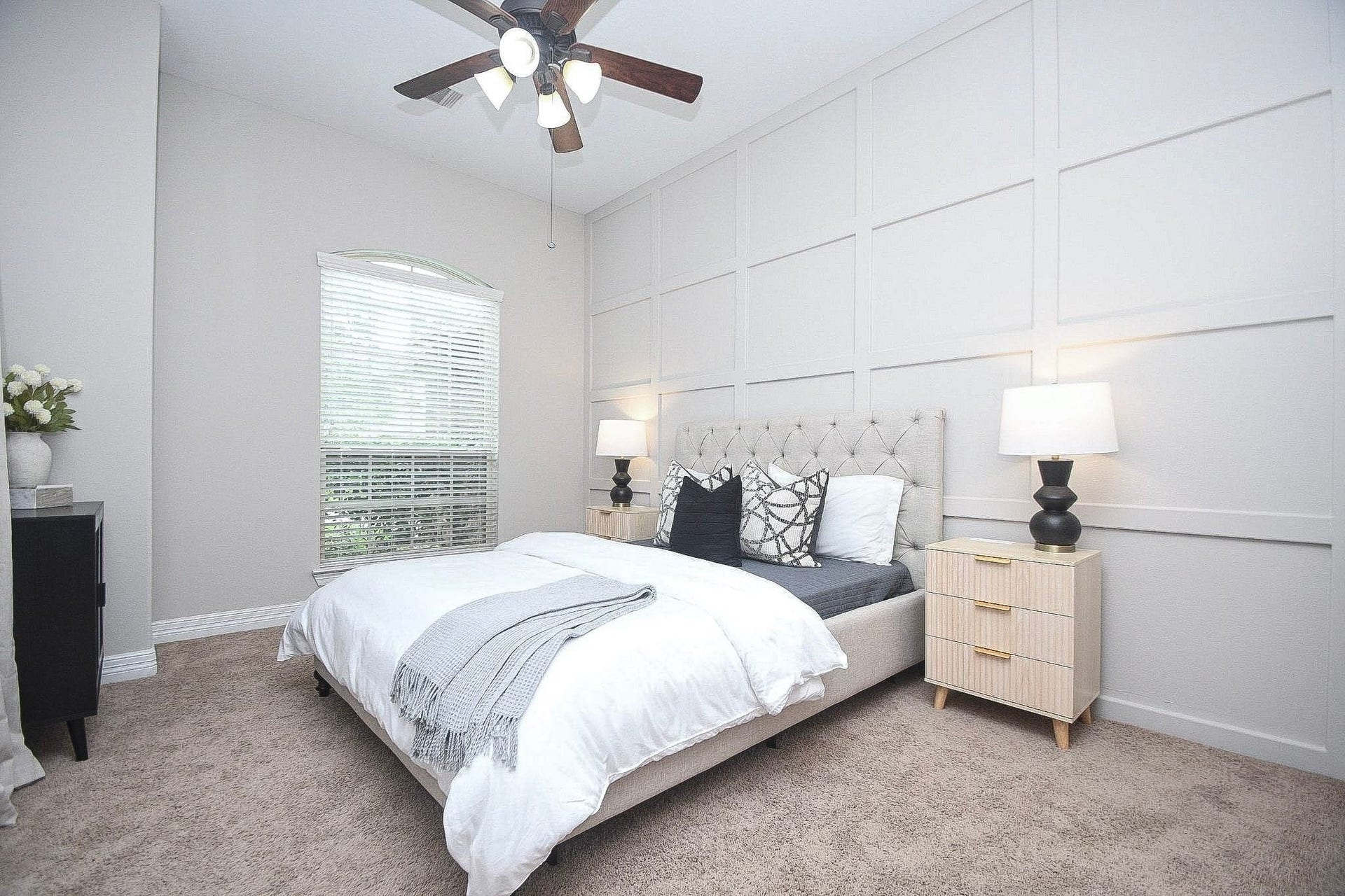 Another view of the bedroom highlighting the spacious layout and convenient location near the entry.