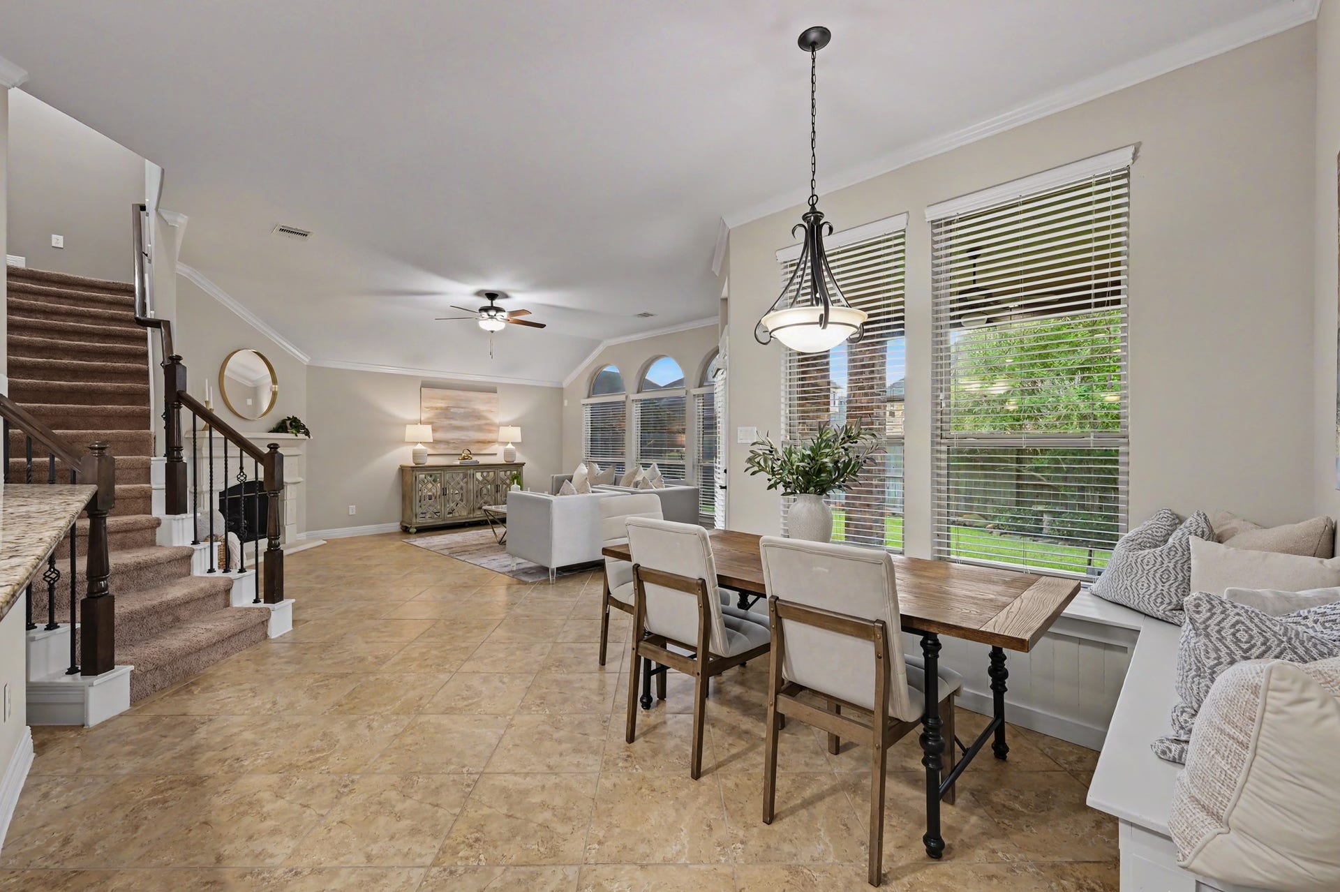 Breakfast area with backyard views, back staircase leads to gameroom and media room with full bath upstairs