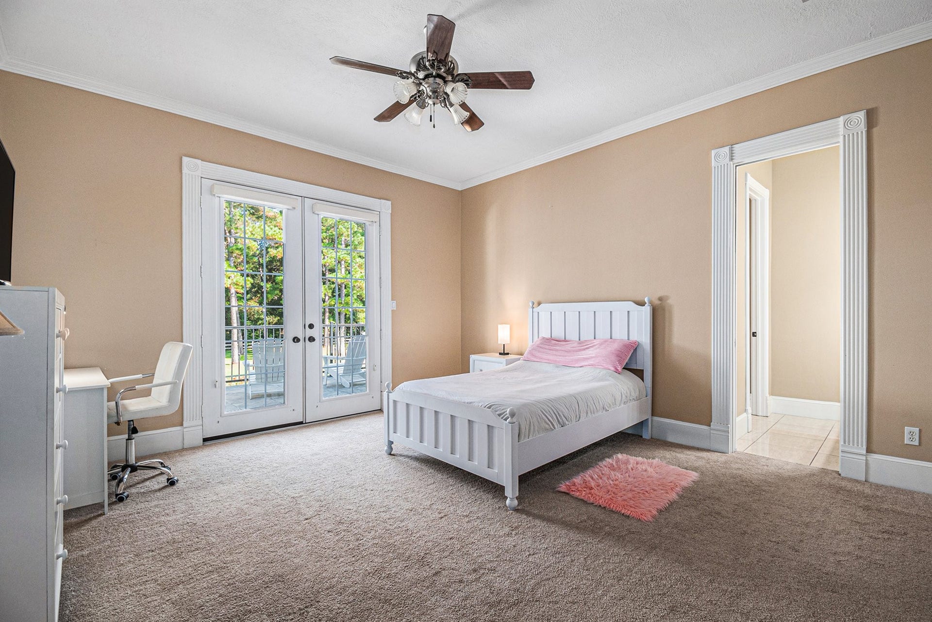 Another secondary bedroom with access to the balcony overlooking the beautiful backyard.