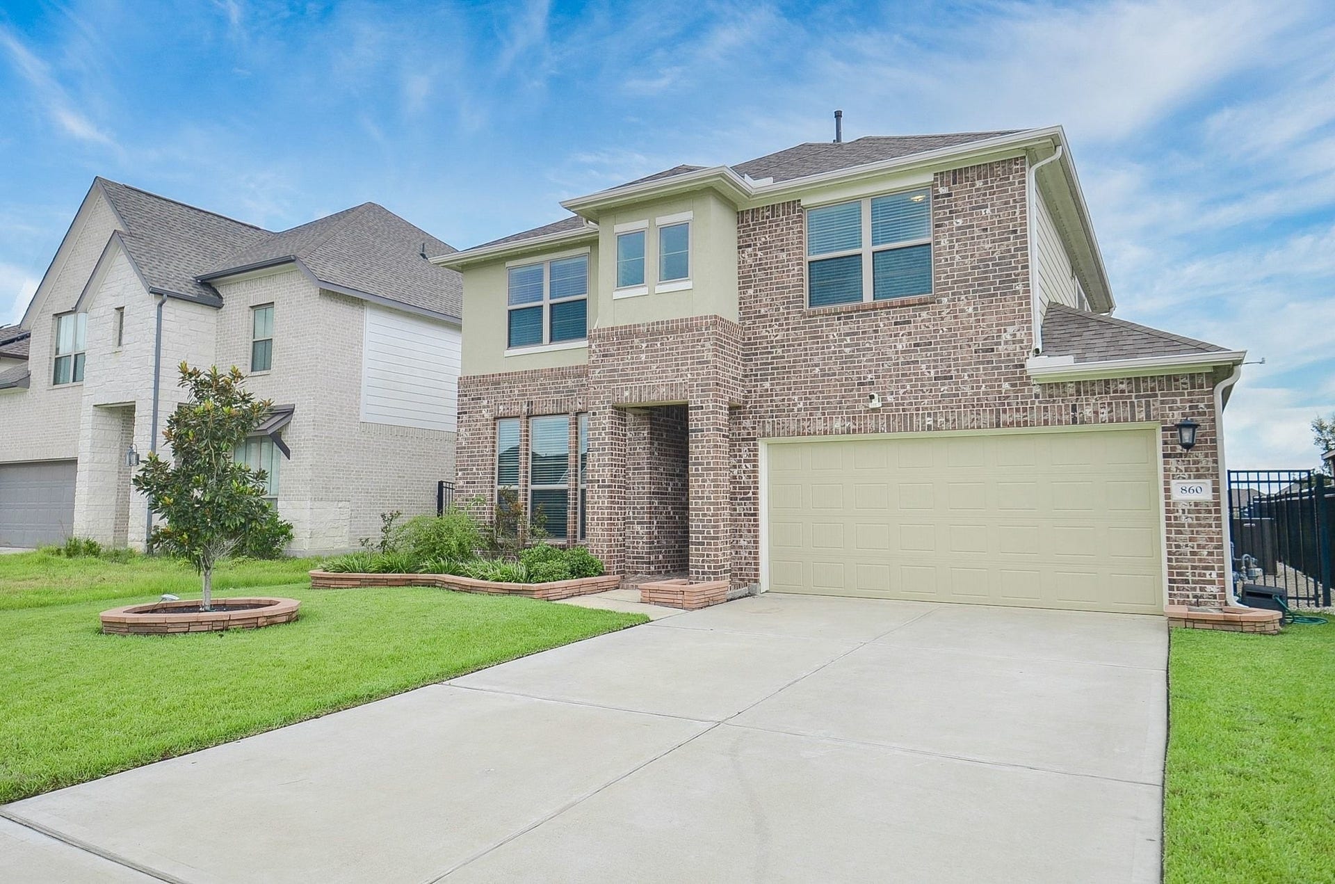 860 Marisol Bay Drive, Katy, TX 77493 The modern exterior features full gutters and an attached two car garage.
