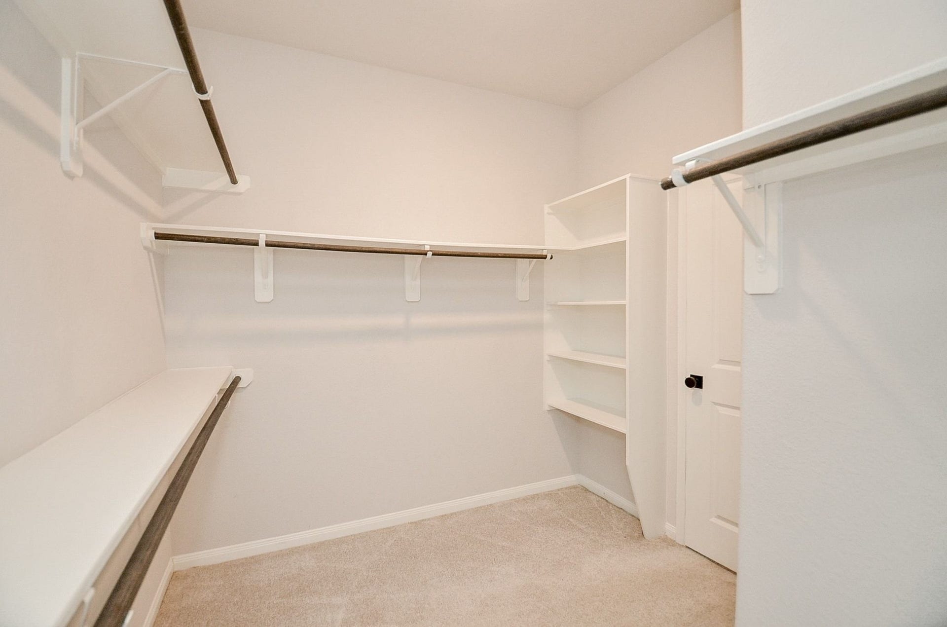 860 Marisol Bay Drive, Katy, TX 77493 The primary walk in closet has ample places for hanging and built in shelving for additional storage of shoes, sweaters and more