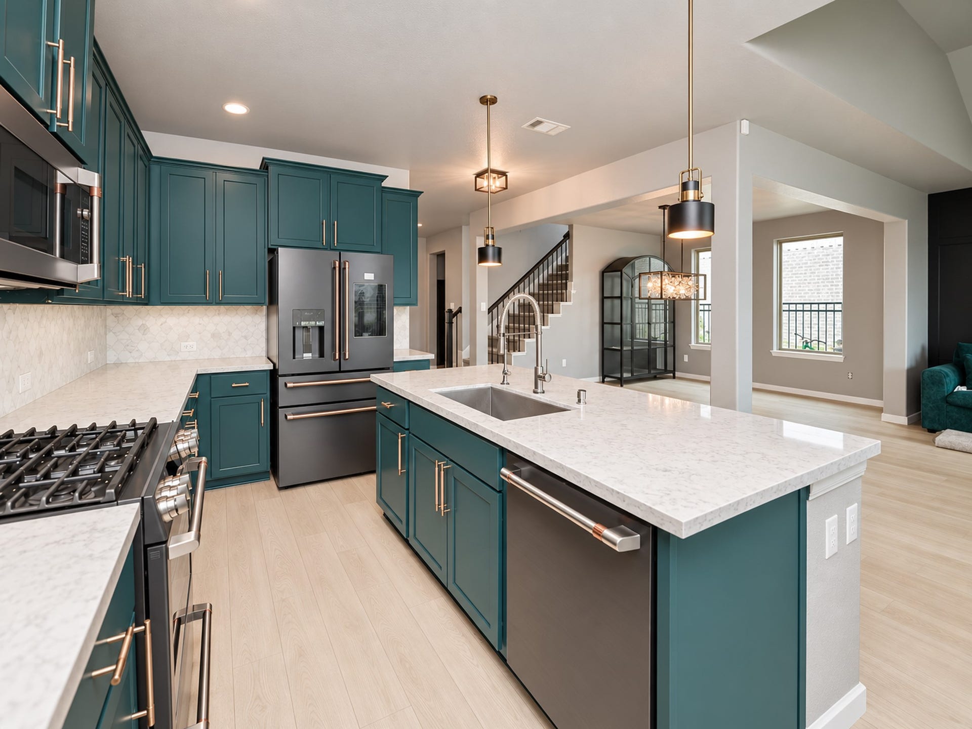 860 Marisol Bay Drive, Katy, TX 77493 This kitchen is designed with custom colors and quartz countertops. All the appliances are black stainless steel that are fingerprint and smudge resistant