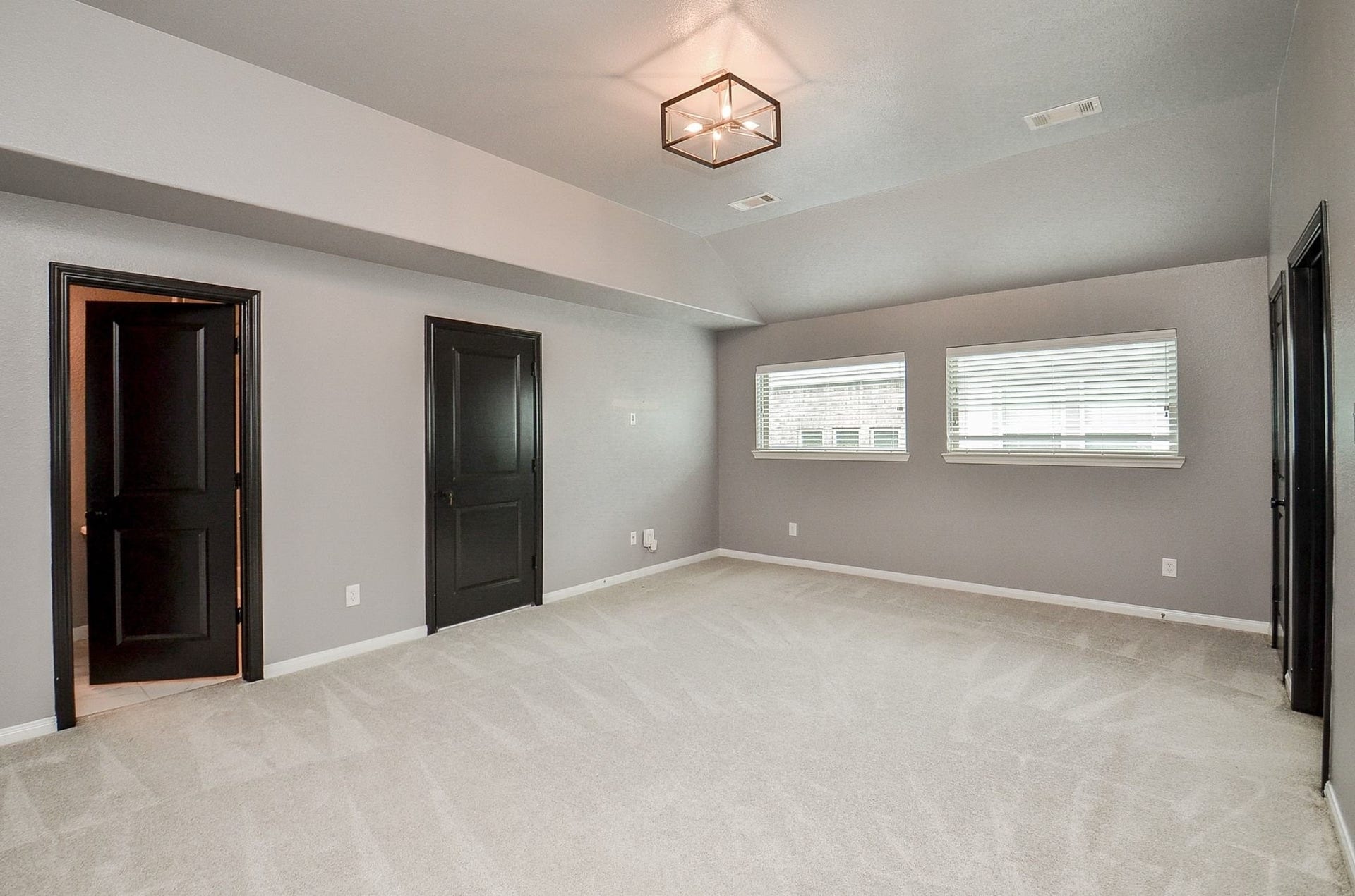 860 Marisol Bay Drive, Katy, TX 77493 At the top of the stairs you arrive to the game room. From this angle you see the shared bathroom and a door leasing to the attic area on the left and the right is the media room and a storage closet.