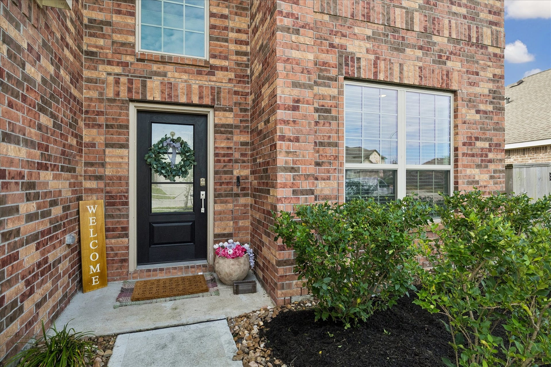 4322 Banfield Hills Lane, Baytown, TX 77521 Captivating front door view that serves as a welcoming entryway to the home.