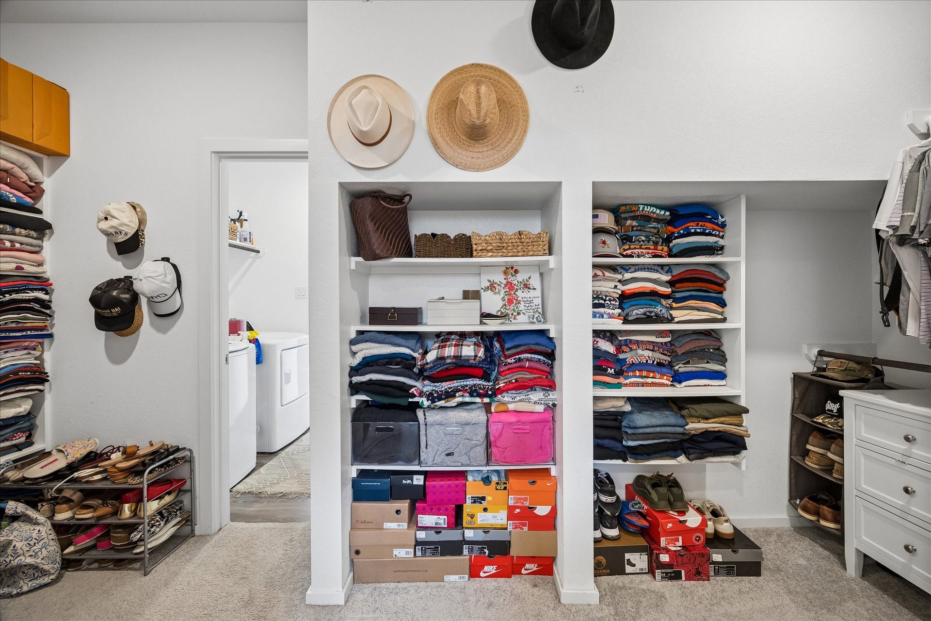 4322 Banfield Hills Lane, Baytown, TX 77521 Large primary closet featuring custom shelving, ample hanging space, and built-in organizers for optimal storage and organization.