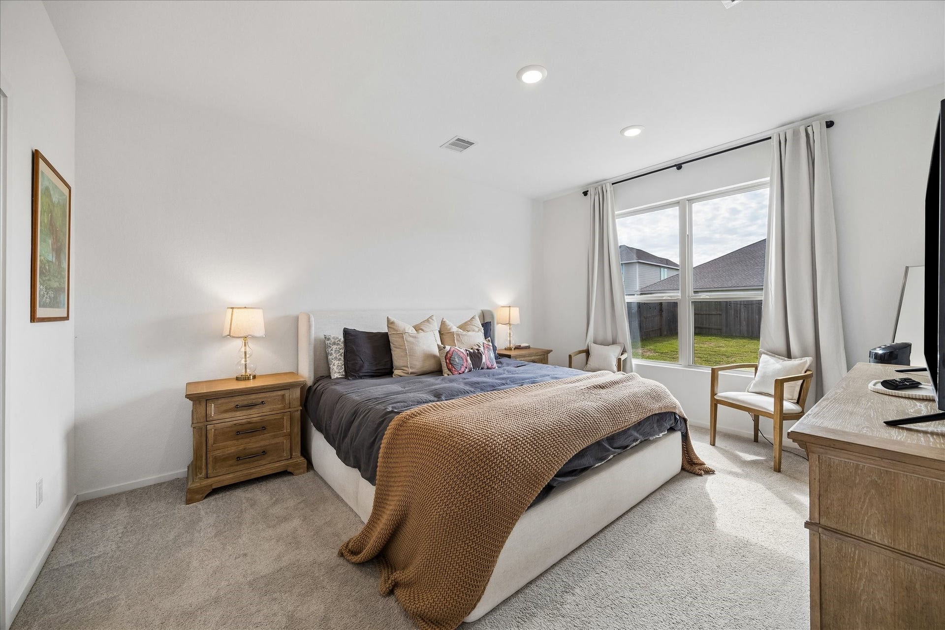 4322 Banfield Hills Lane, Baytown, TX 77521 Large primary bedroom with expansive walk-in closet and en-suite spa-inspired bathroom. This spacious retreat features abundant natural light, plush carpeting.