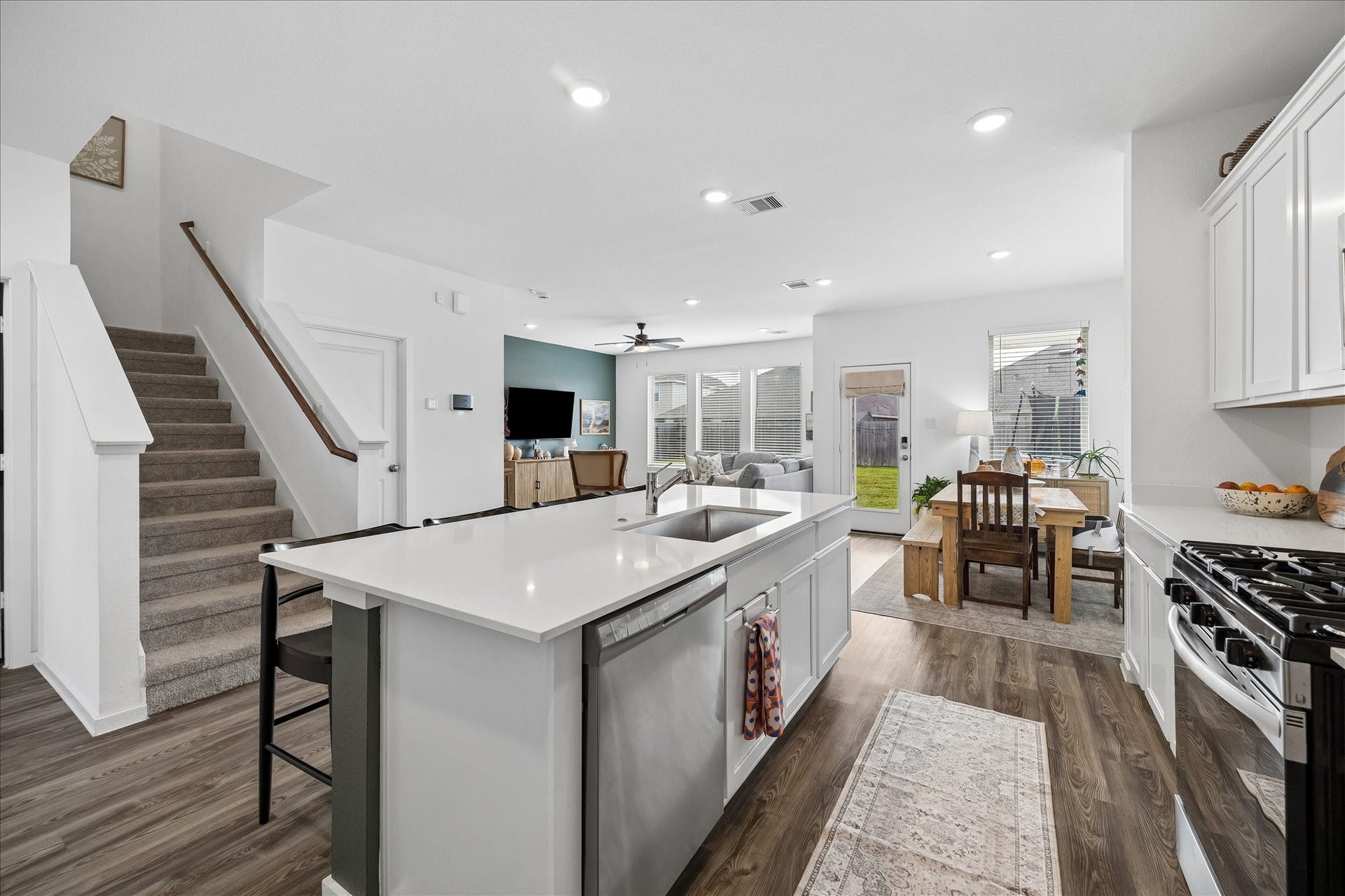 4322 Banfield Hills Lane, Baytown, TX 77521 Open concept at its finest! This bright, airy home features a seamless flow from the living area to the kitchen, perfect for entertaining and modern living. Large windows fill the space with natural light, highlighting the high-end finishes and spacious layout.