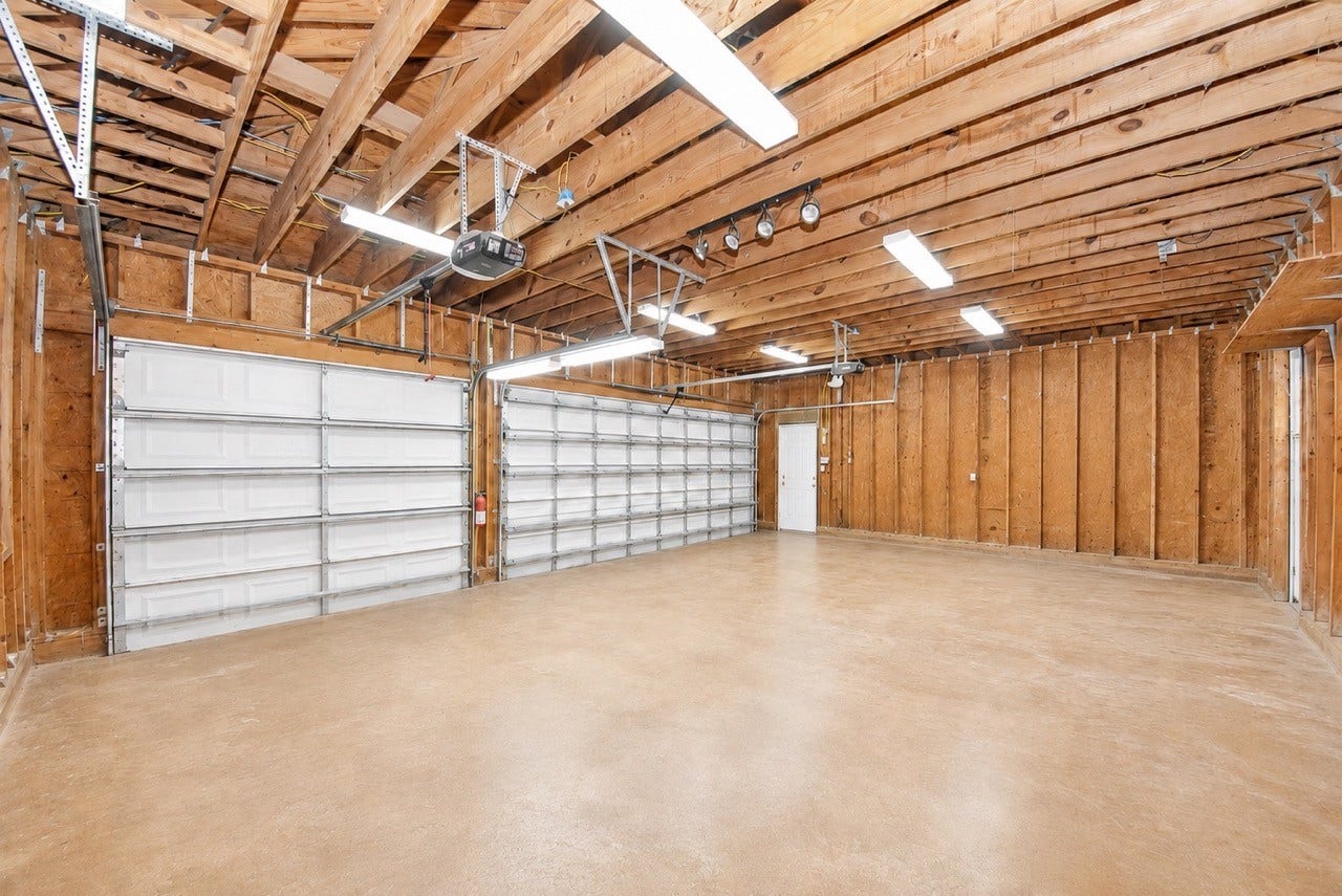 3237 Avenue G 1/2, Santa Fe, TX 77510 Oversized 3 car garage.