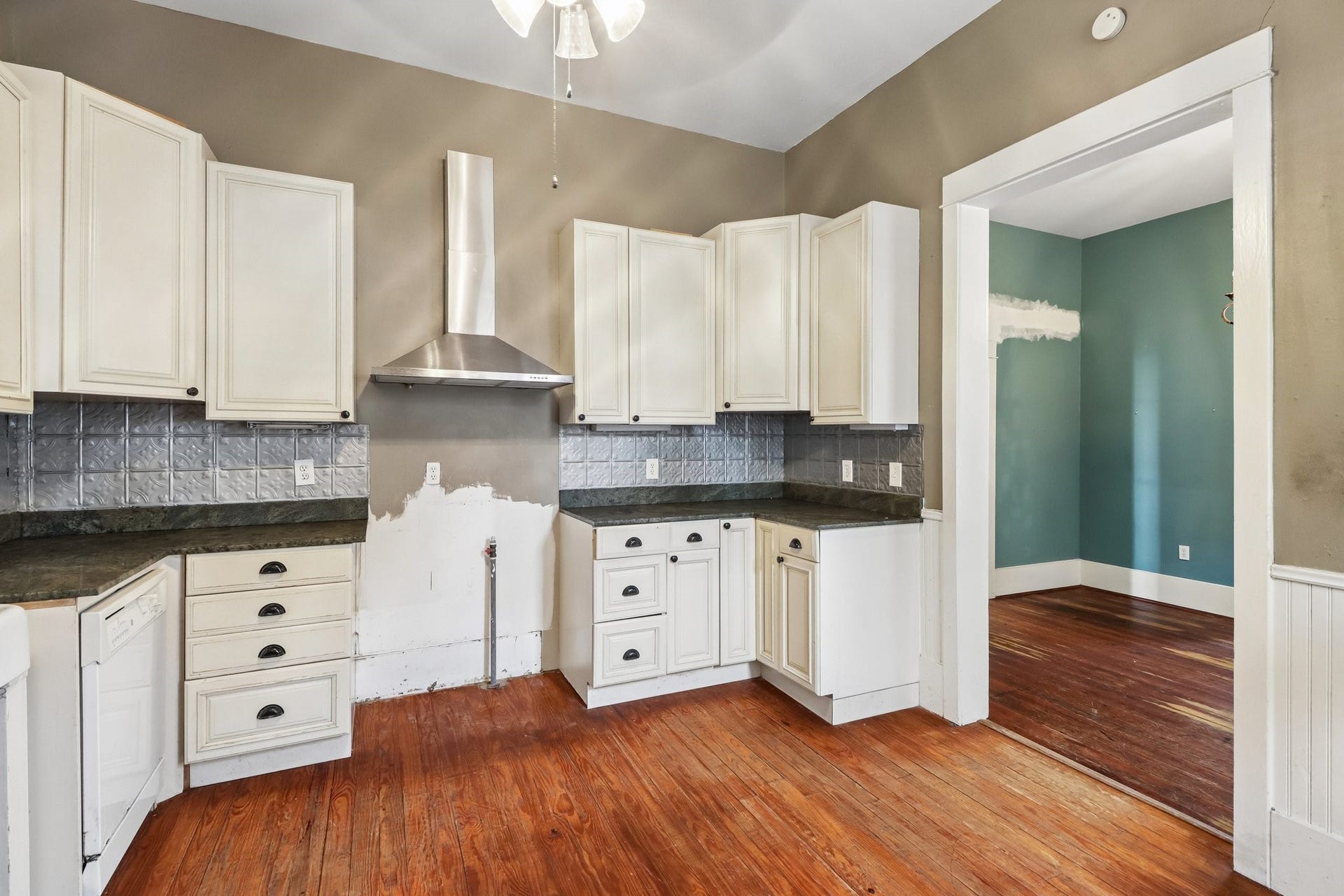 2318 Avenue M, Galveston, TX 77550 Another view of the kitchens cabinet storage, counter space and window-lined layout.
