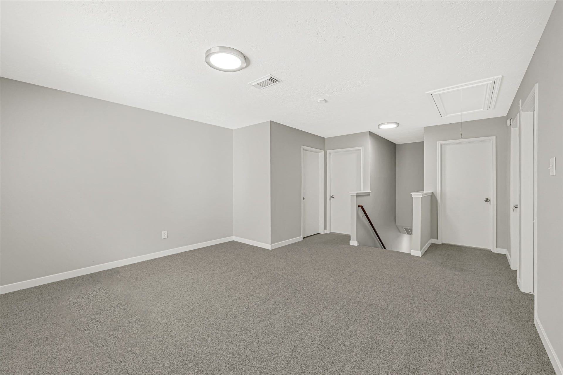 game room featuring a flexible layout perfect for both high-energy relaxation and a dedicated work-from-home environment.