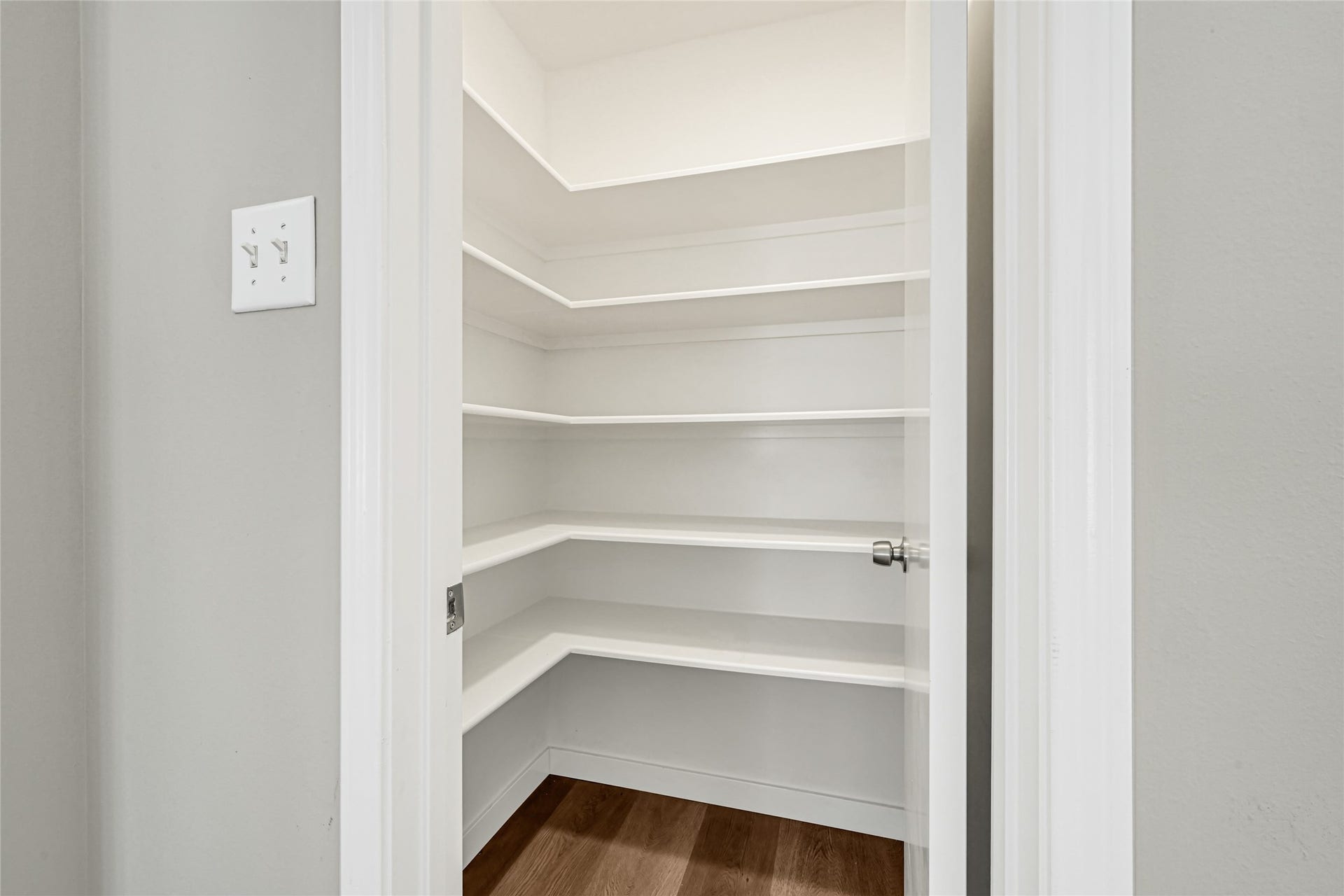 Got snacks? This walk-in pantry is a true organizational dream, offering expansive shelving that provides abundant space to neatly arrange all your dry goods and favorite treats