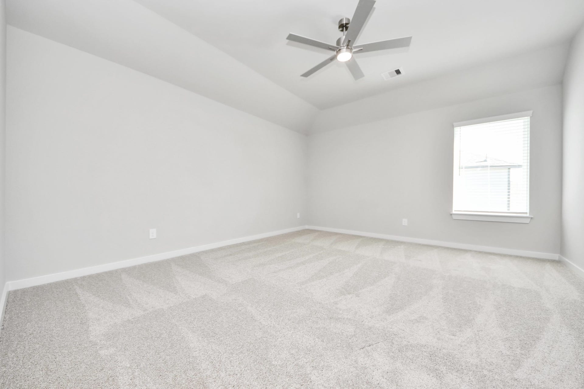 Come upstairs and enjoy a day of leisure in this fabulous game room! This is the perfect hangout spot or adult game room! Features plush carpet, high ceilings, custom paint and windows for plenty of natural light. Sample photo of completed home with similar floor plan. Actual colors and selections may vary.
