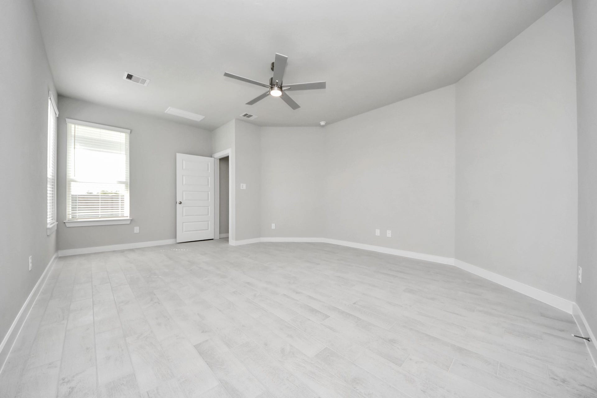 Come and unwind after a long day in this magnificent primary suite! This spacious room features beautiful flooring, warm paint, high ceilings and large windows with privacy blinds. Sample photo of completed home with similar floor plan. Actual colors and selections may vary.