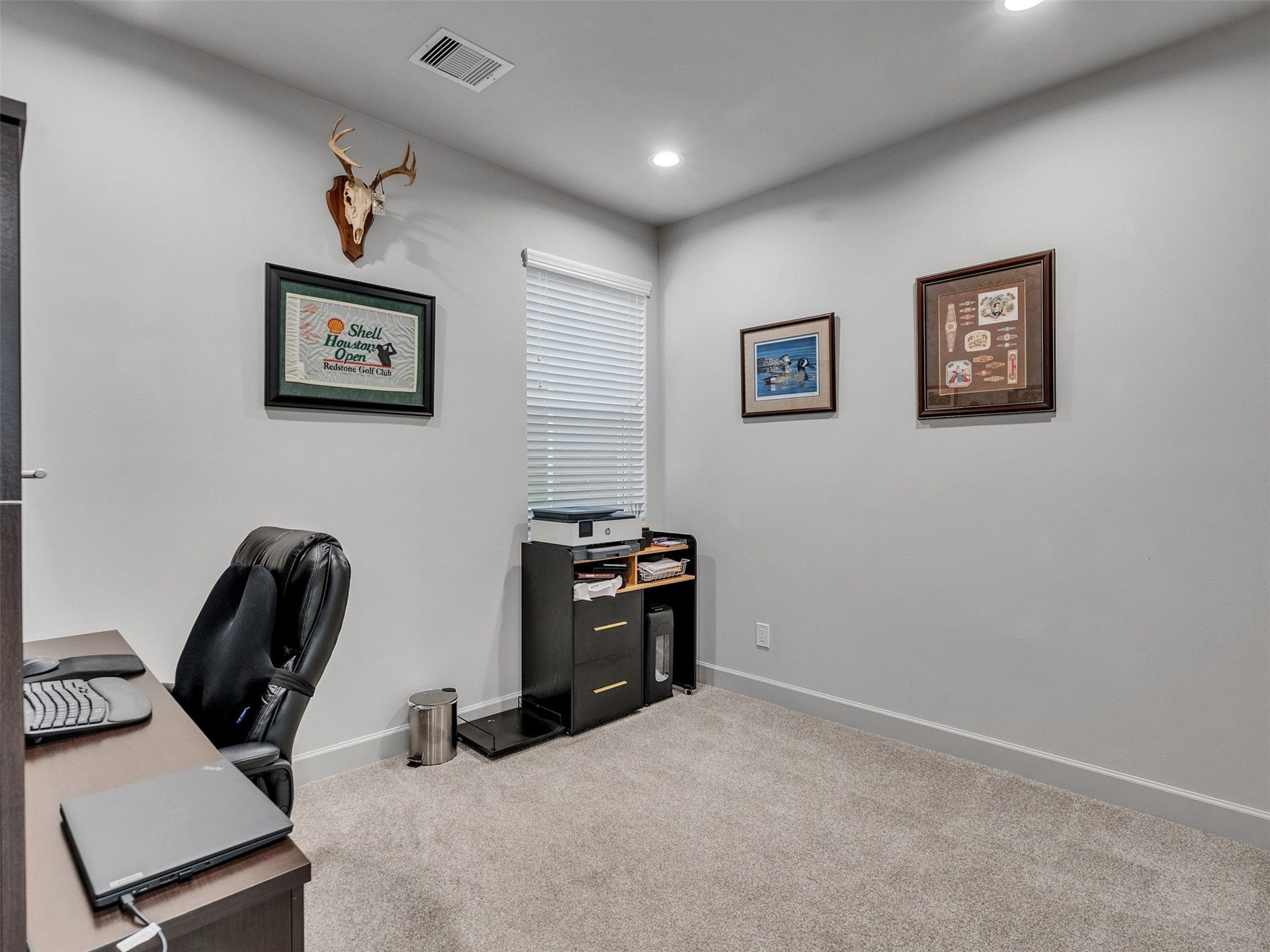 Versatile secondary bedroom currently styled as a quiet home office.