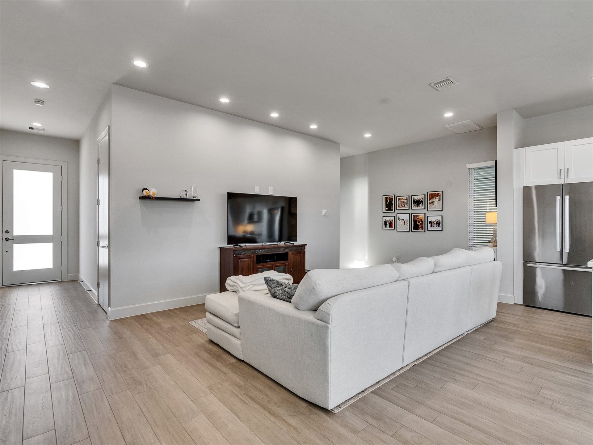 Spacious, light-filled living area featuring low maintenance tile floors.