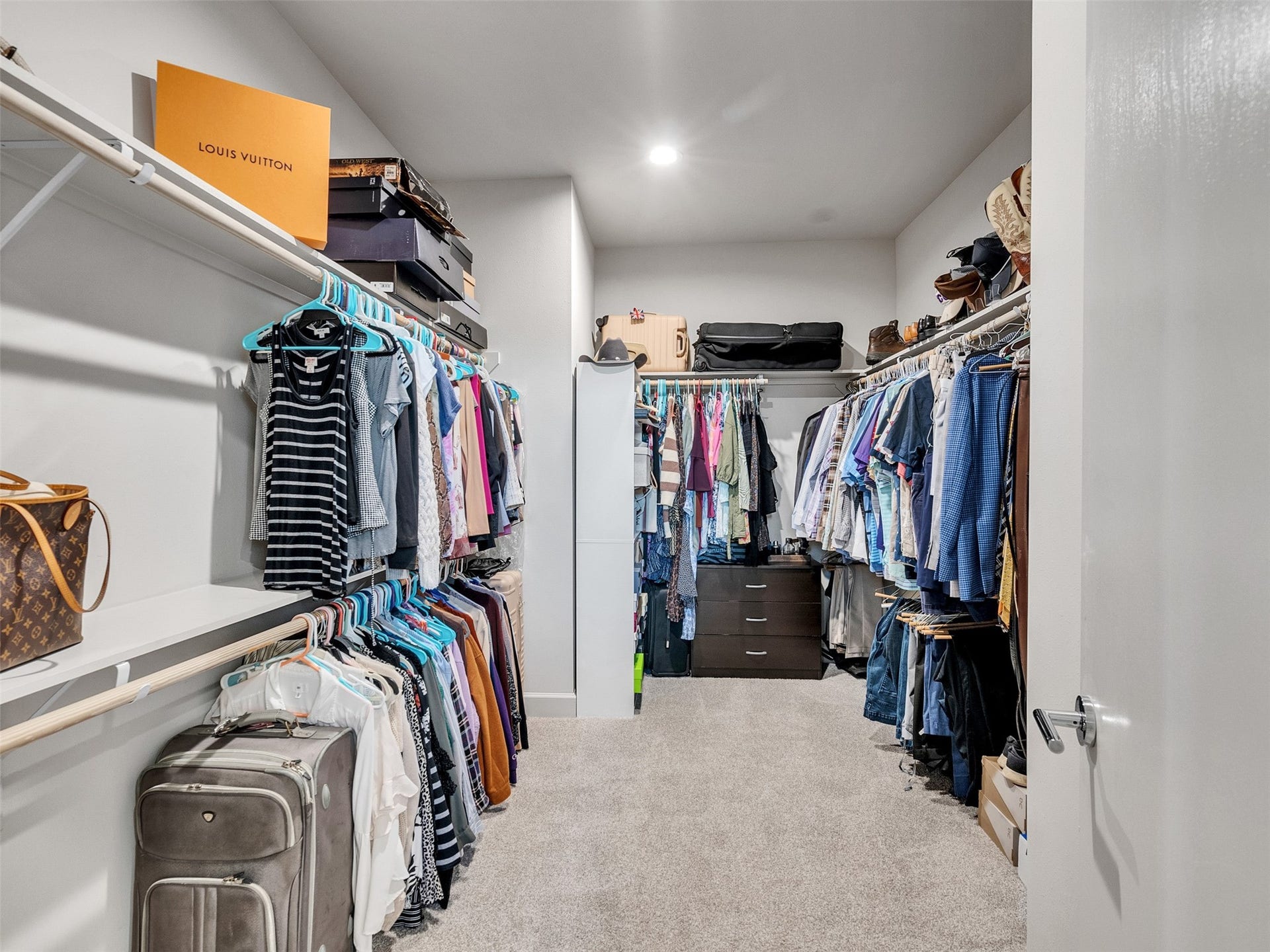 Enormous primary closet with double shelving and hanging space.  Rare to find such a space in a home this size.