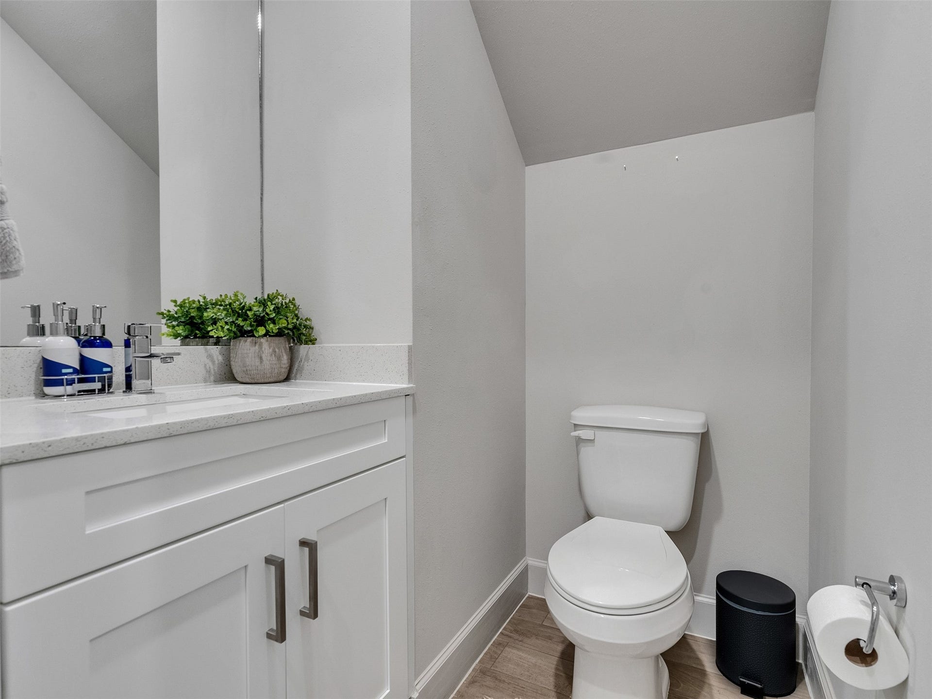 Convenient and stylish downstairs powder room with modern fixtures.