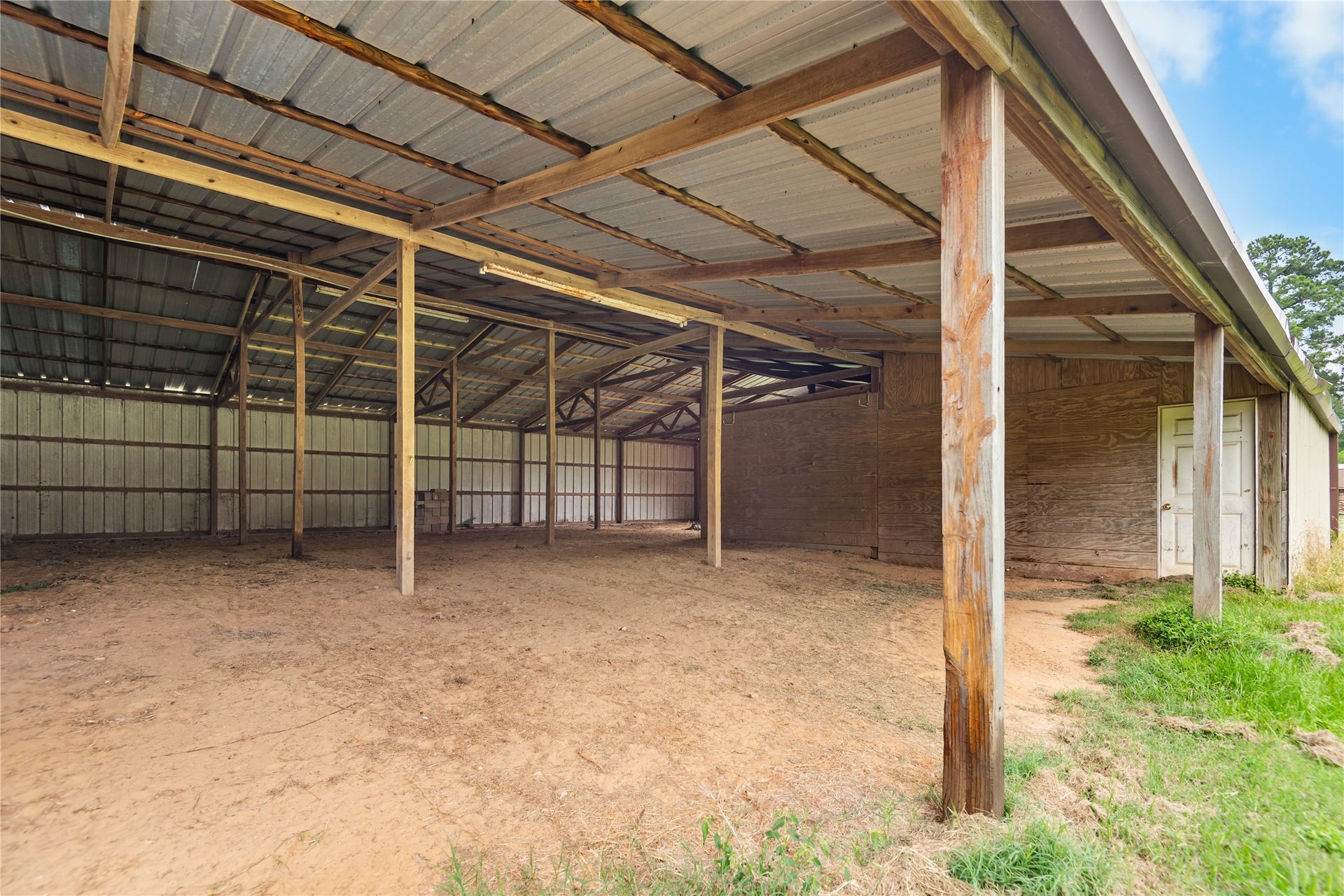 30307 Rickett Lane, Magnolia, TX 77355 Covered barn area with ample room for storage, projects, trailers, tractors, or hobby use.