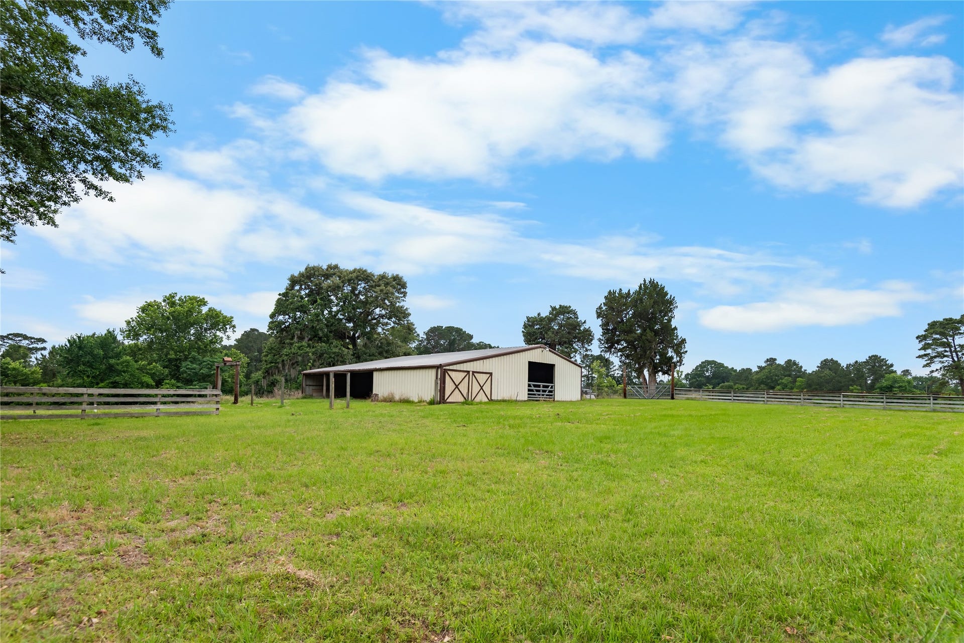 30307 Rickett Lane, Magnolia, TX 77355 Covered barn area with ample room for storage, projects, trailers, tractors, or hobby use.