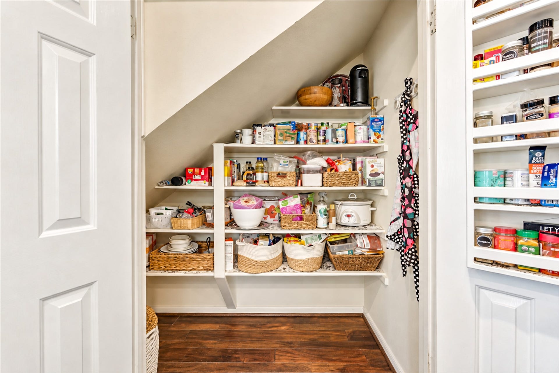 23338 Grand Springs Drive, Katy, TX 77494 Making use of every space, this walk in pantry with spice rack extends to the left under the stairs.
