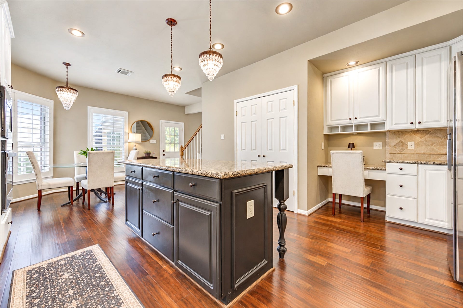 23338 Grand Springs Drive, Katy, TX 77494 There is ample storage everywhere even under this island. Original lighting has been replaced with can lighting and wonderful pendants. The hardwoods are the crowning touch.