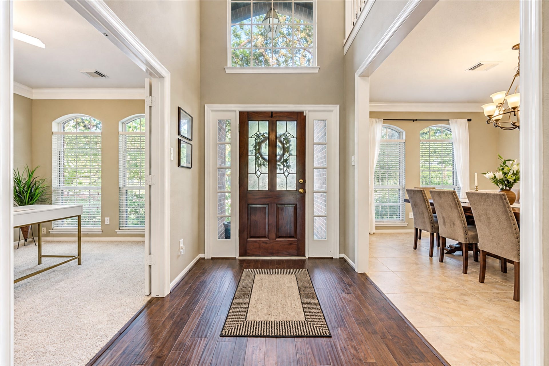 23338 Grand Springs Drive, Katy, TX 77494 The leaded glass front door with dual sidelights and transom opens to a two story hardwood entry.