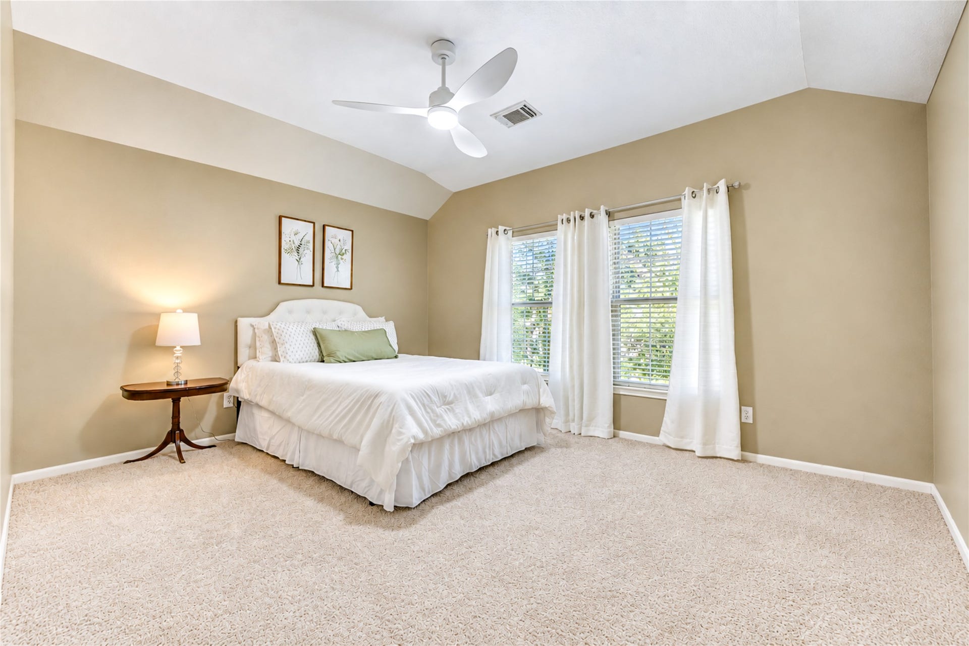 23338 Grand Springs Drive, Katy, TX 77494 This large secondary bedroom boasts high ceilings, a walk in closet and an updated remote control ceiling fan. It shares a Jack and Jill bath with the previous bedroom.