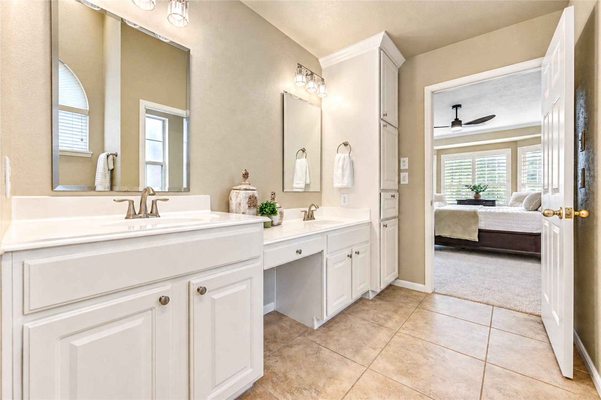 23338 Grand Springs Drive, Katy, TX 77494 A vanity sitting area, linen cabinet and clothes hamper checks every box for a luxury primary bath.