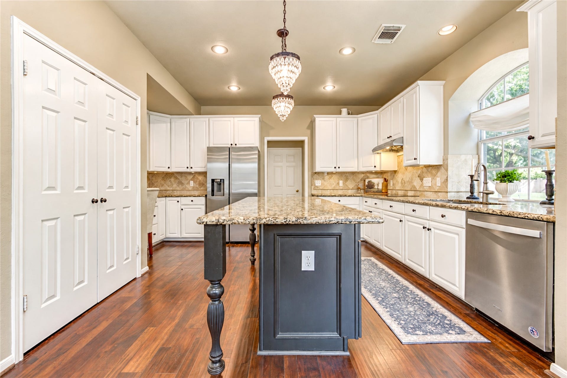 23338 Grand Springs Drive, Katy, TX 77494 This kitchen is a home chef's dream with tons of cabinets and counterspace! Undercabinet lighting is the icing on the cake.