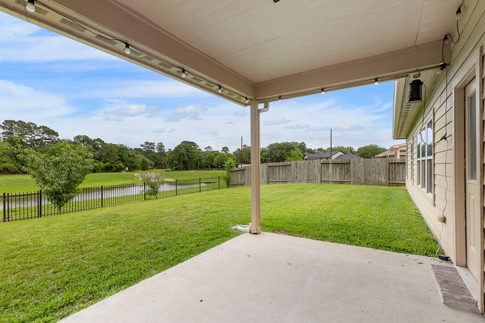 22810 Dale River Road, Tomball, TX 77375 Covered back porch is a great space to relax and enjoy your water and nature views.