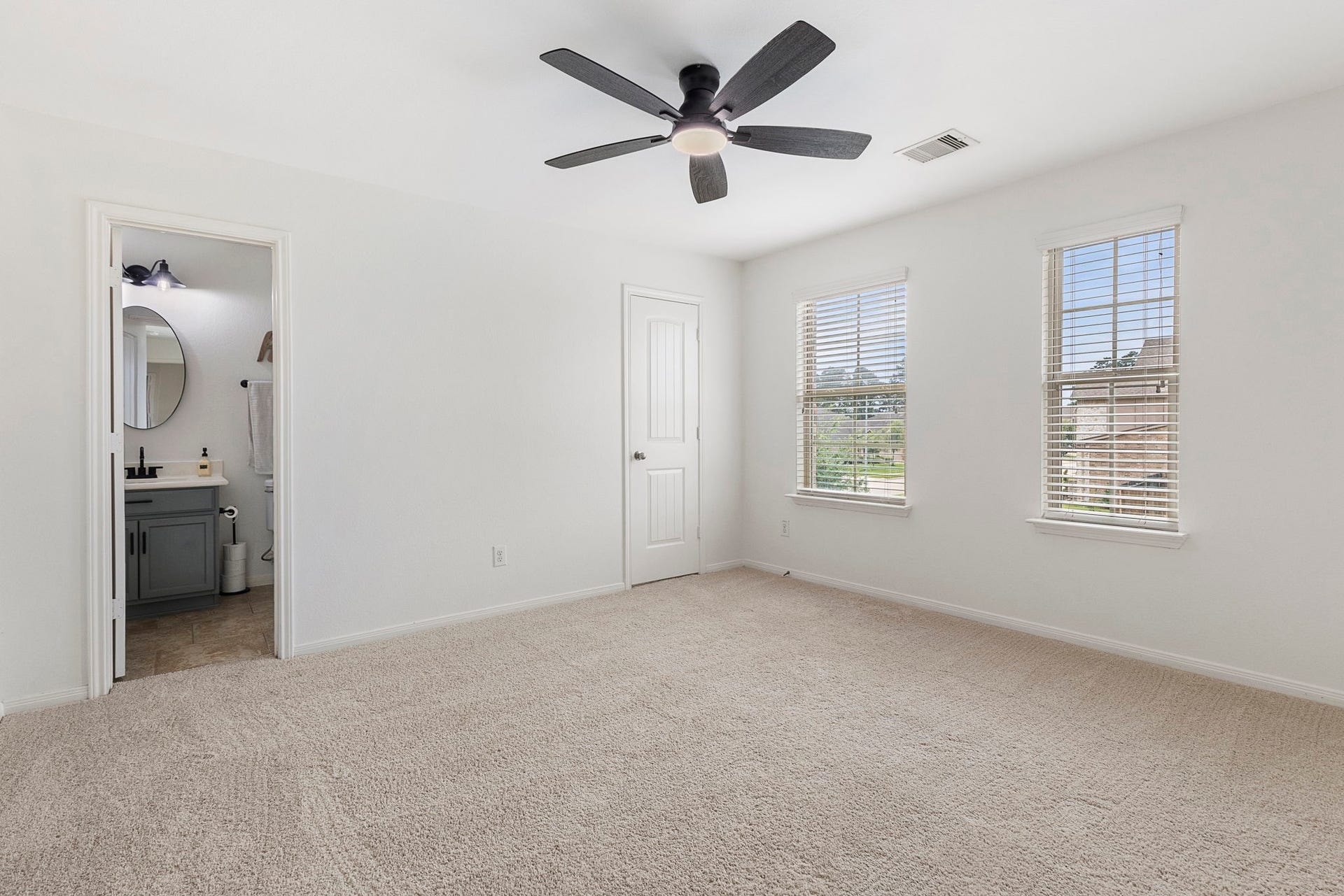 22810 Dale River Road, Tomball, TX 77375 One of four additional bedrooms upstairs. This one has a private ensuite bathroom.