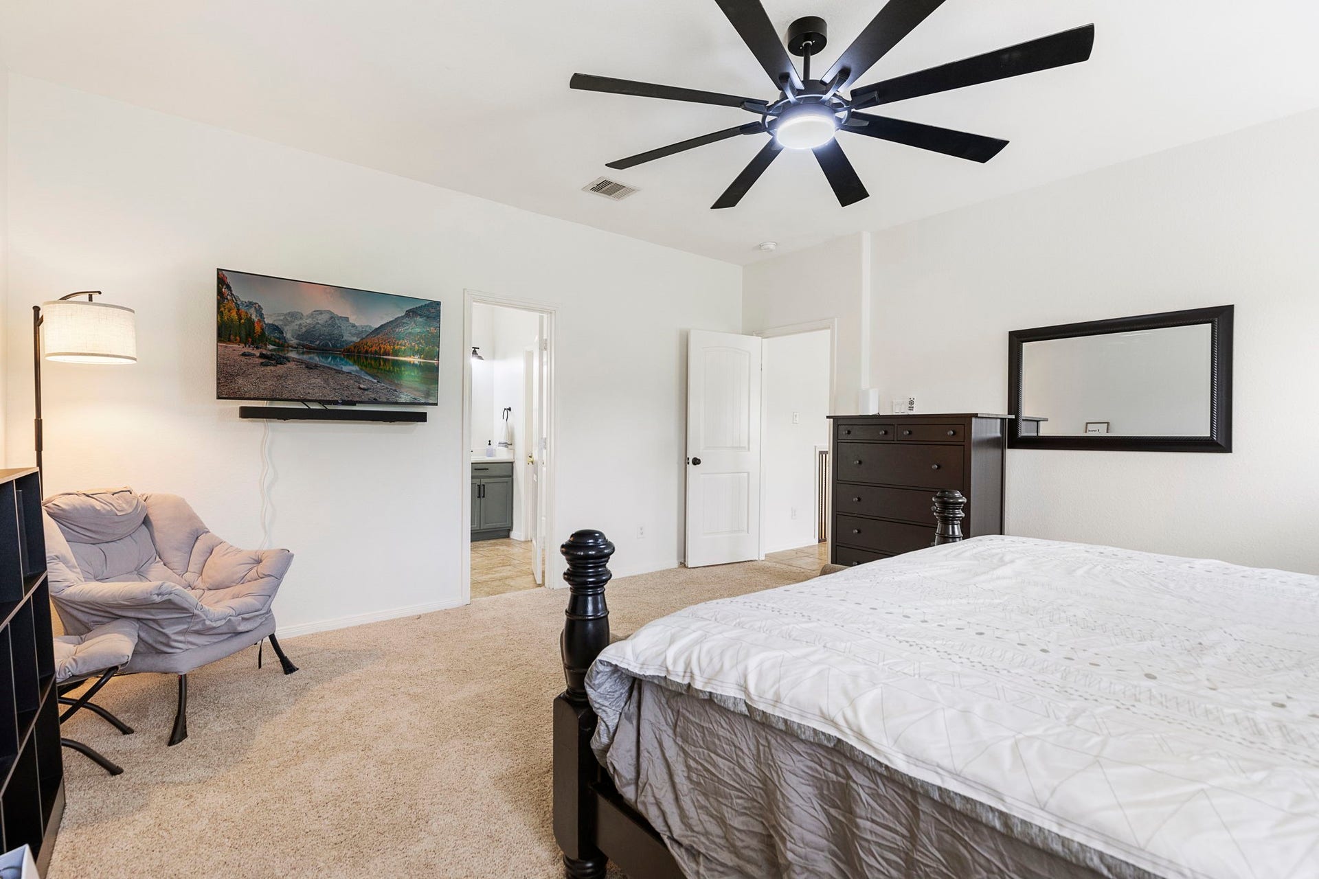 22810 Dale River Road, Tomball, TX 77375 The primary suite is large enough for multiple pieces of furniture and still room to move around.