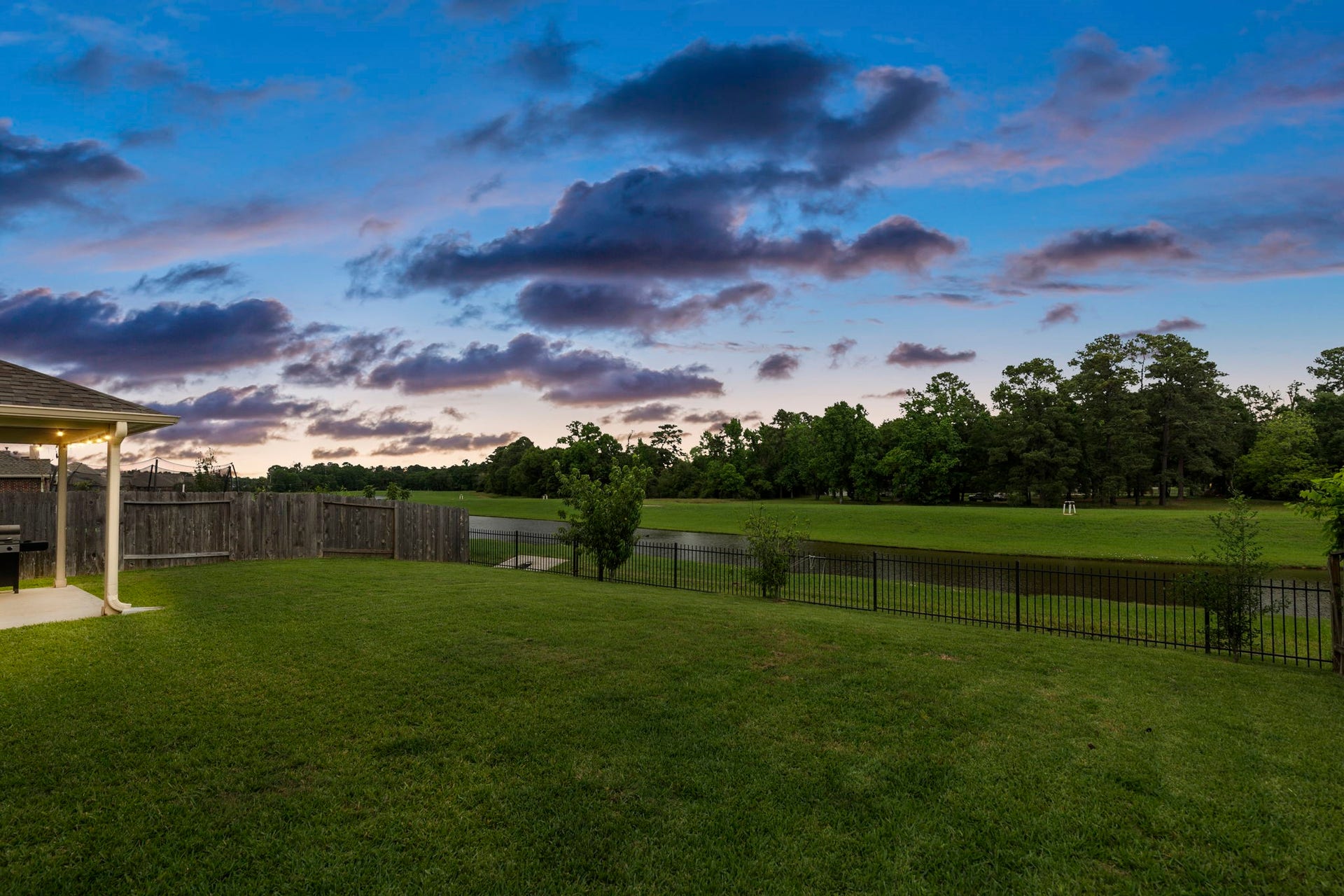 22810 Dale River Road, Tomball, TX 77375 Rain or shine, sunrise or sunset, this backyard was designed for relaxing and perfect for entertaining.