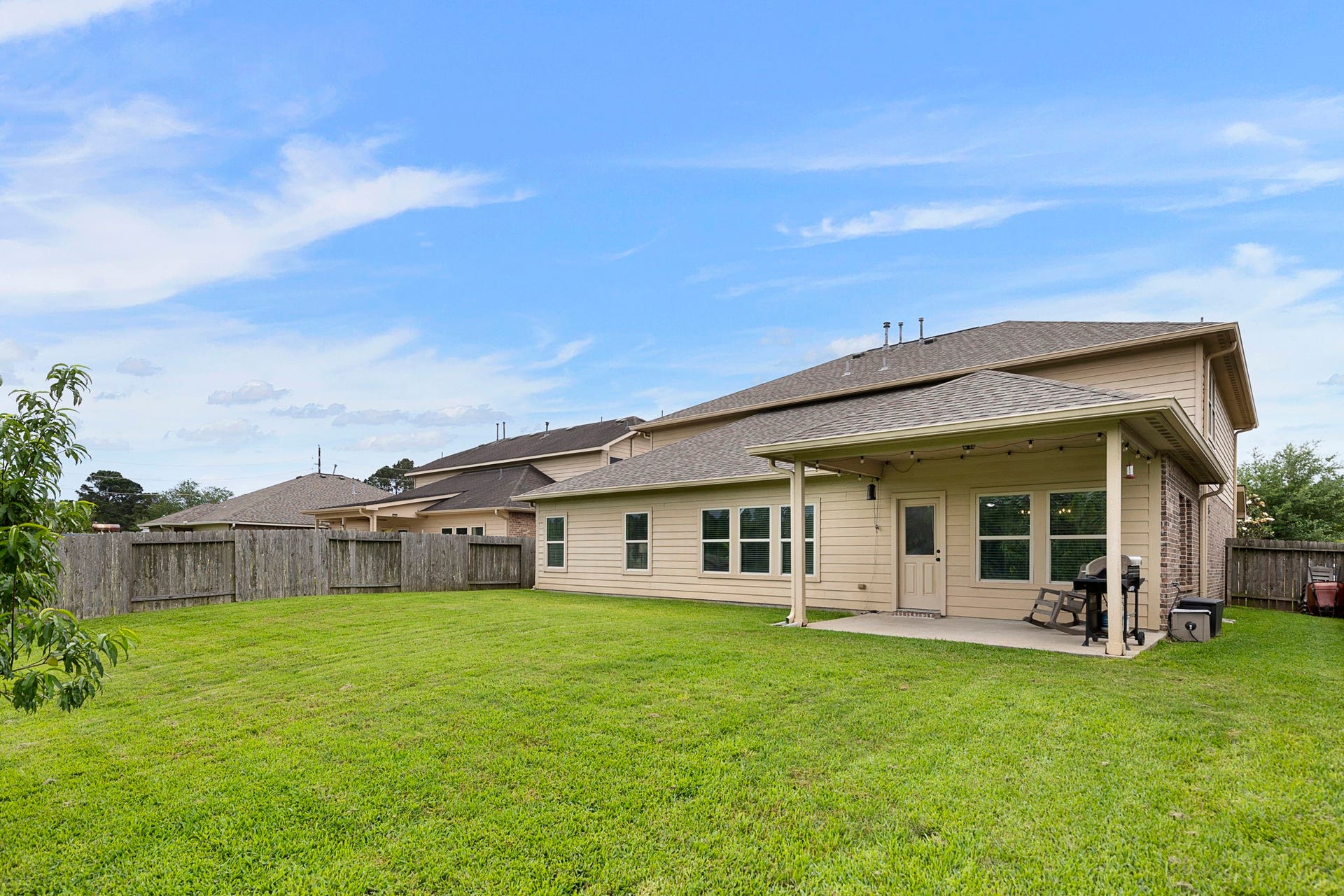 22810 Dale River Road, Tomball, TX 77375 This large backyard offers plenty of space for a trampoline or playset and still enough room to run around!