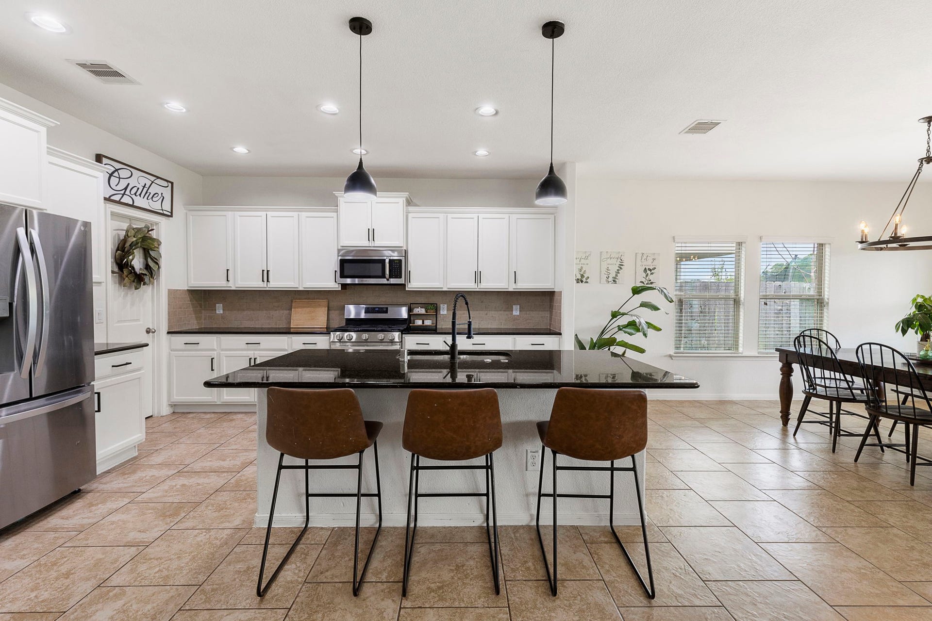22810 Dale River Road, Tomball, TX 77375 Oversized island with easy eat-in option plus tons of additional counter and cabinet space in this large kitchen.