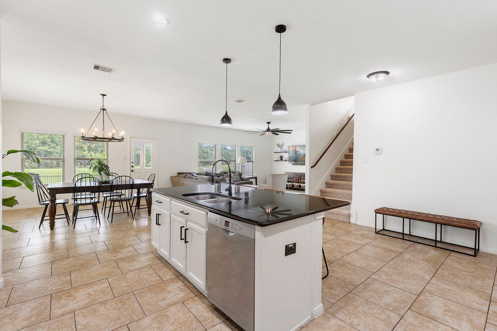 22810 Dale River Road, Tomball, TX 77375 Updated lighting, neutral paint and oversized tile highlight this downstairs living area.
