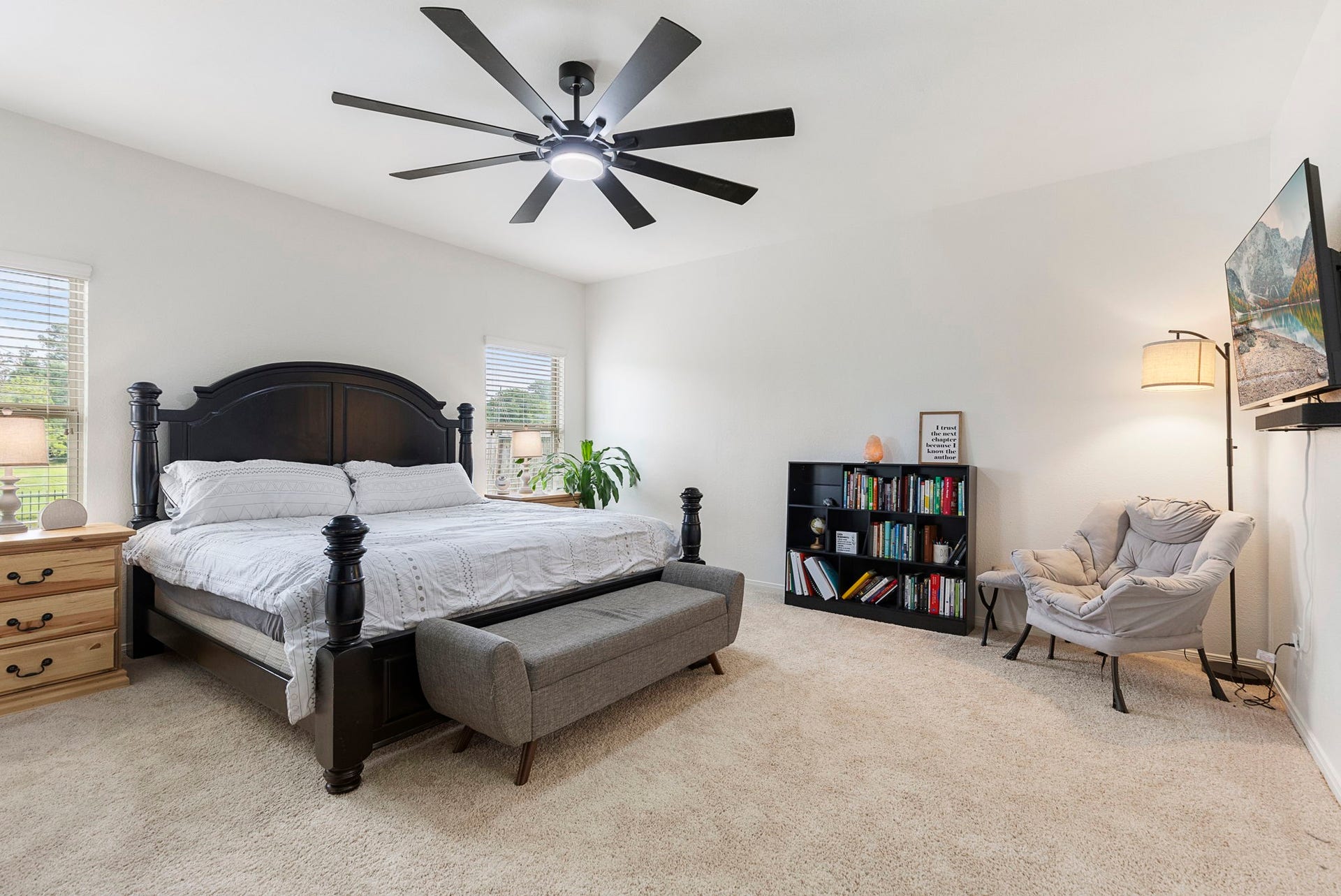 22810 Dale River Road, Tomball, TX 77375 Primary suite privately tucked away on the first floor with brand new carpet, upgraded ceiling fan and awesome backyard views.