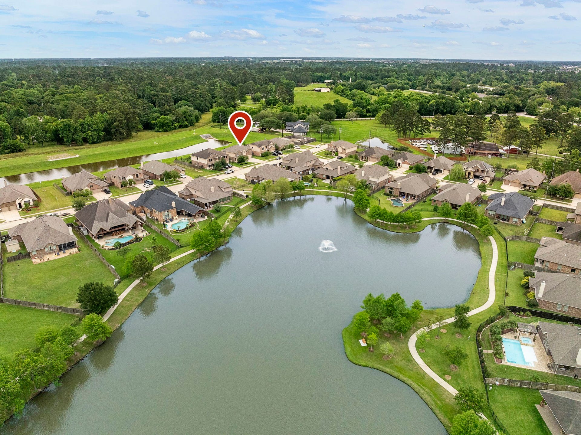 22810 Dale River Road, Tomball, TX 77375 Not only does this house back to water, it is also just across the street from a huge fish-stocked lake with walking trails!