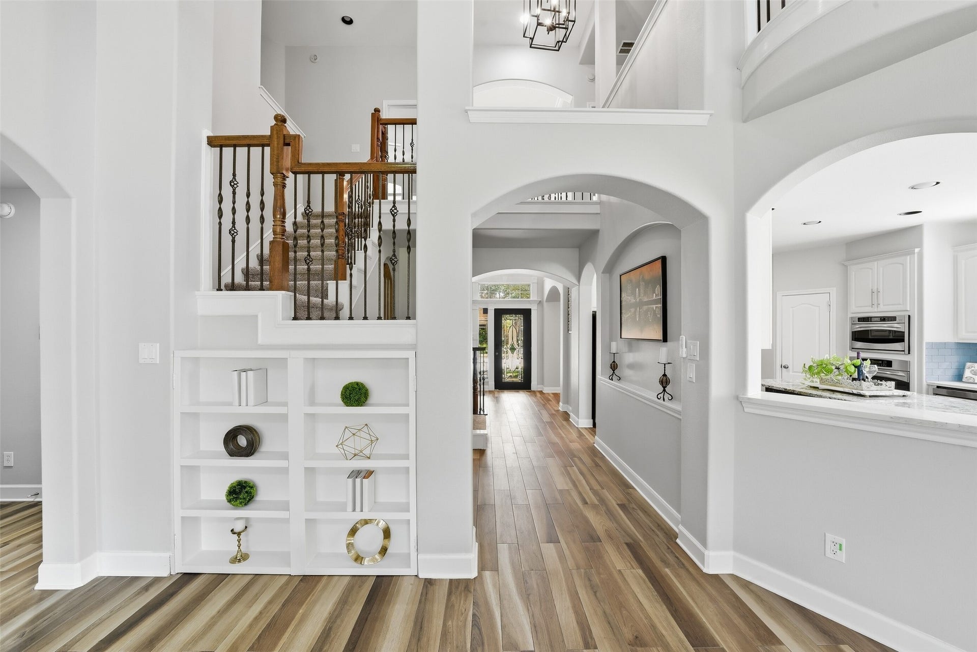 2710 Golden Larch Drive, Katy, TX 77494 This built-in shelf is a secondary access to the storage space under the staircase.